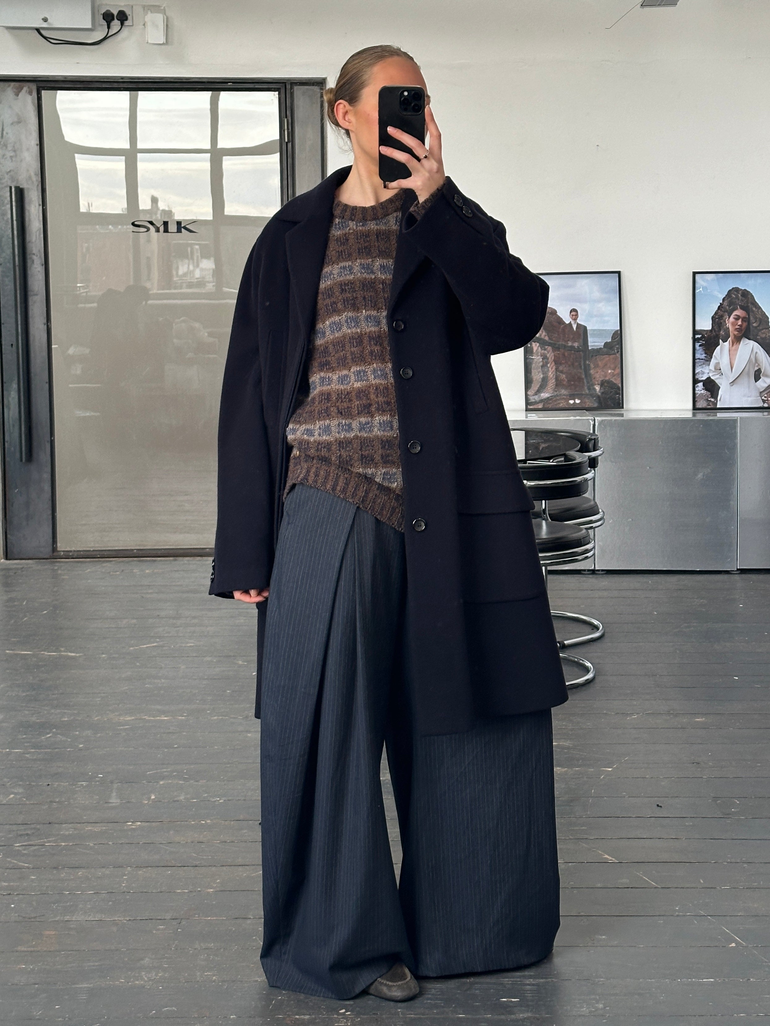 Vintage 1990s wool single-breasted coat in XL/XXL, classic design with a tailored fit and textured fabric, displayed on a hanger.