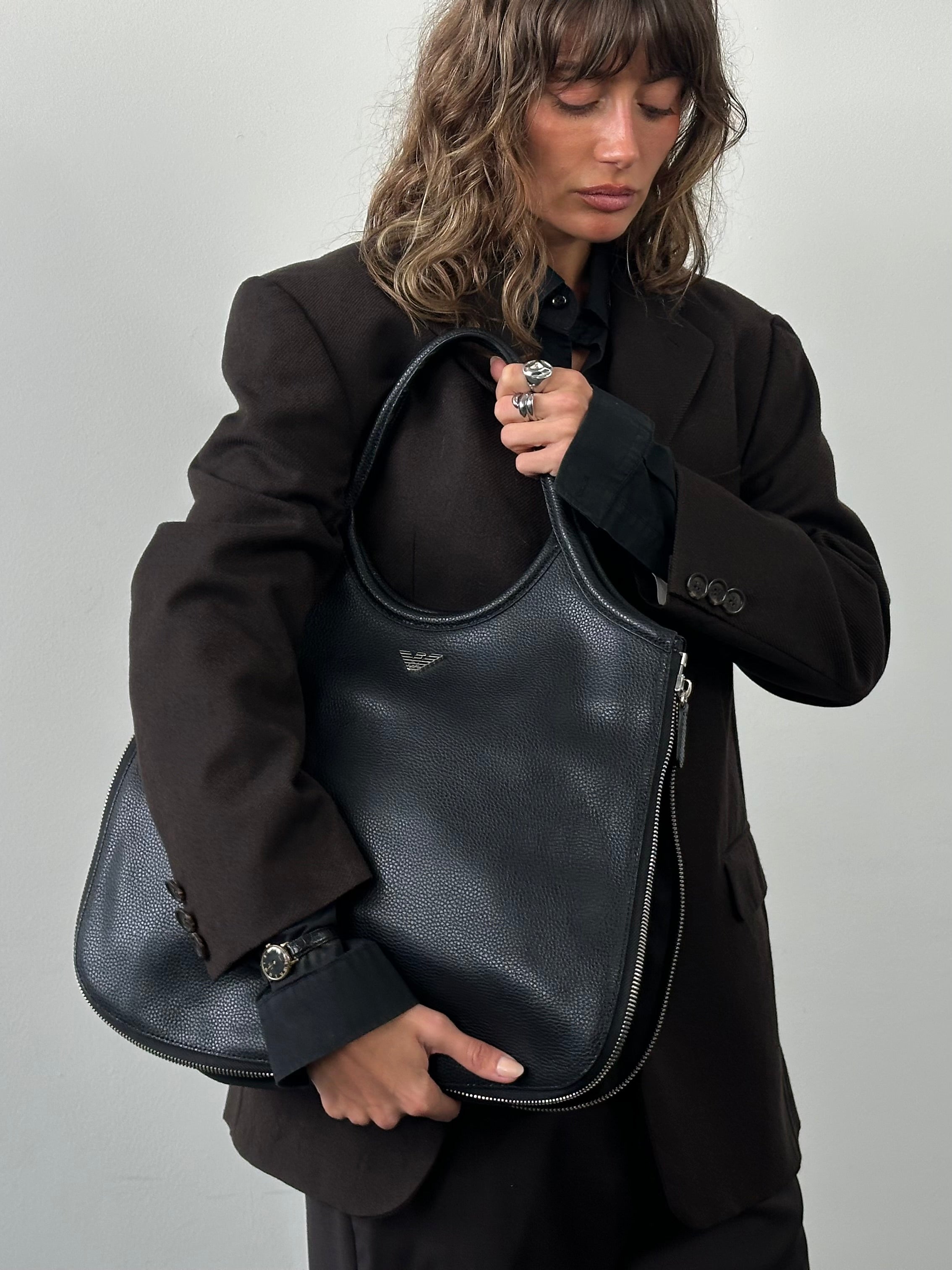 Emporio Armani 1990s leather shoulder bag with sleek design and structured shape, featuring a classic timeless look.