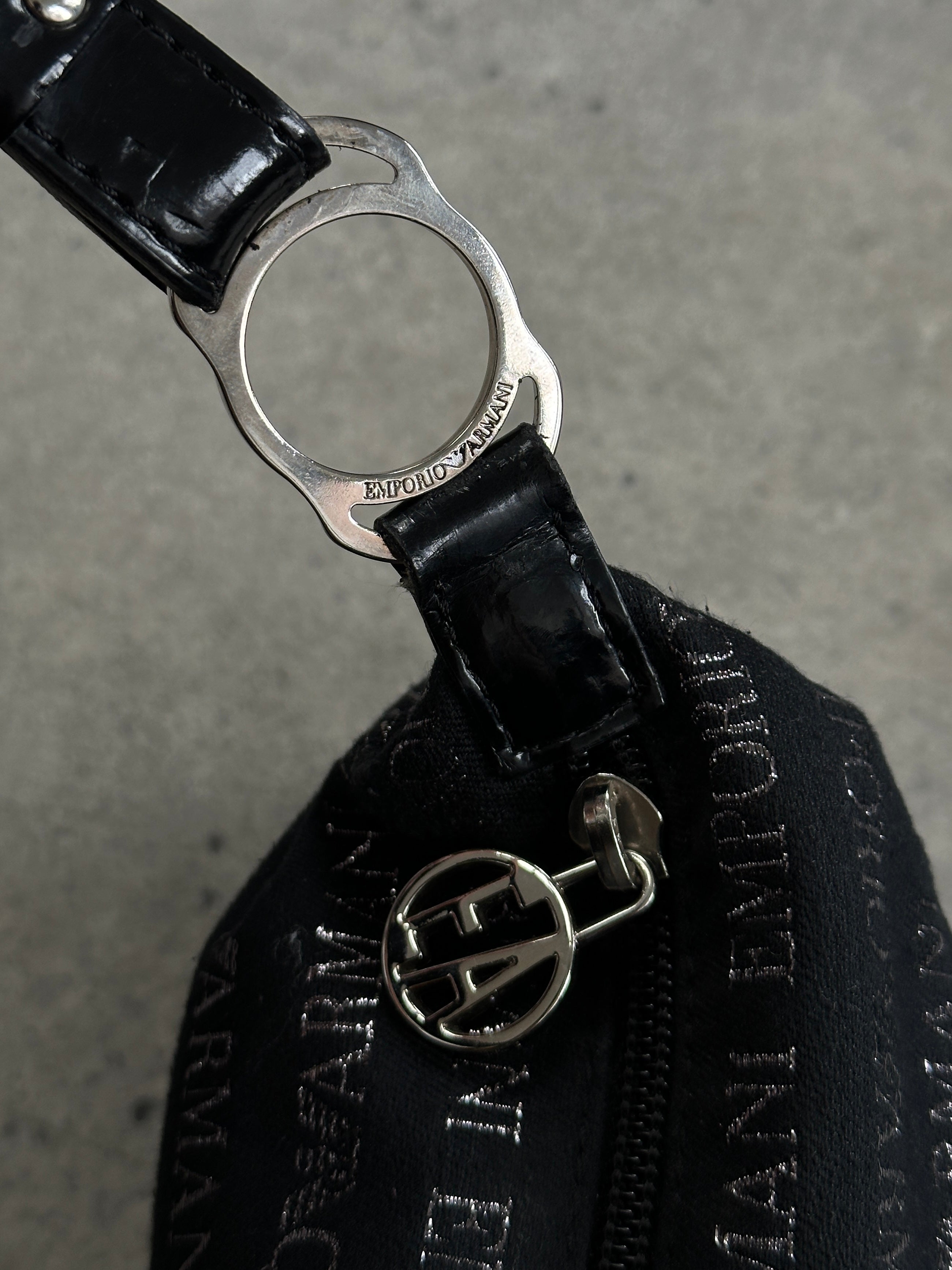 Emporio Armani Monogram Shoulder Bag featuring a stylish design, with leather strap and signature Armani monogram pattern.