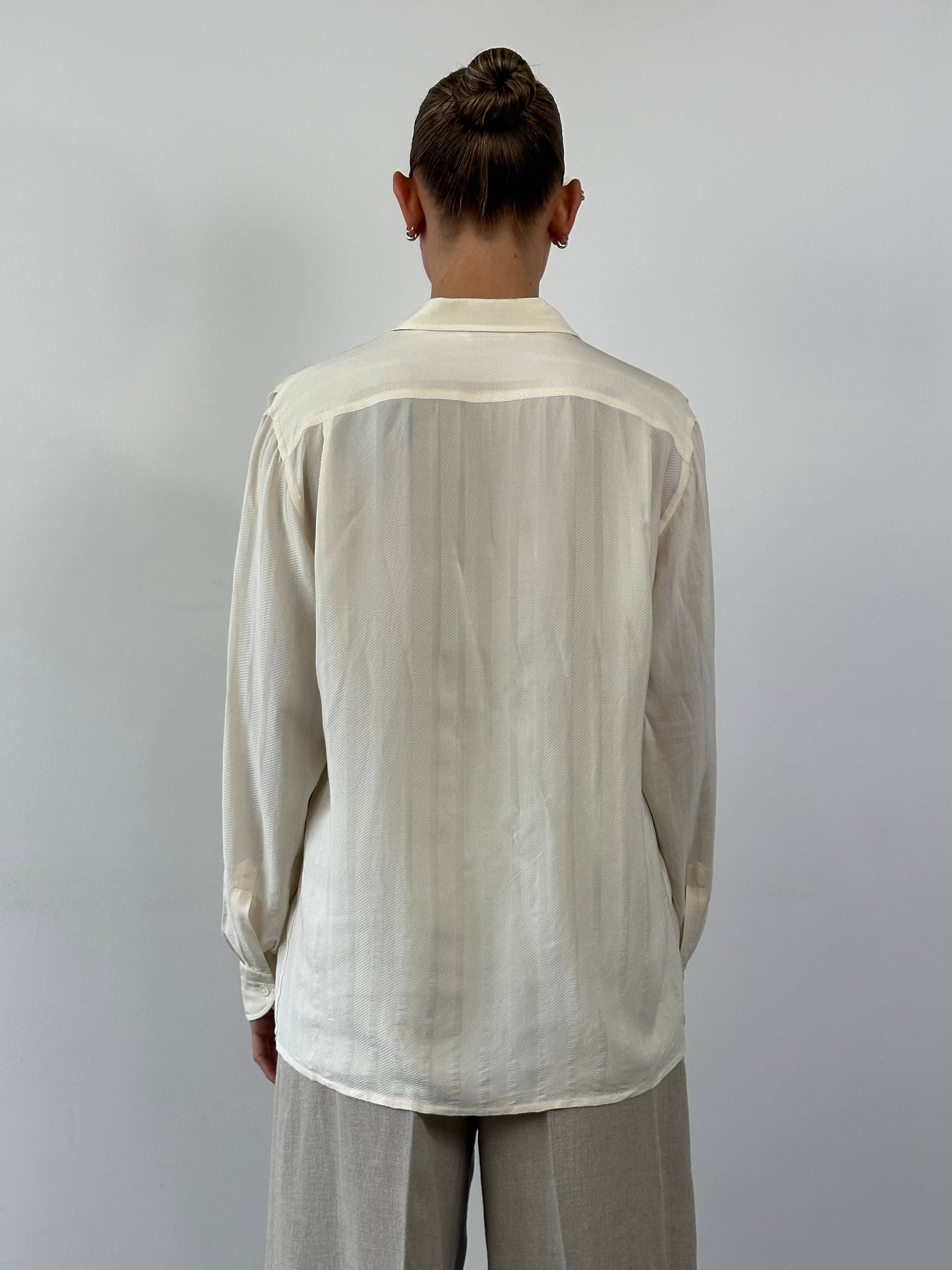 Vintage pure silk polo shirt in size L/XL, featuring a classic collar and smooth silk fabric, displayed on a neutral background.