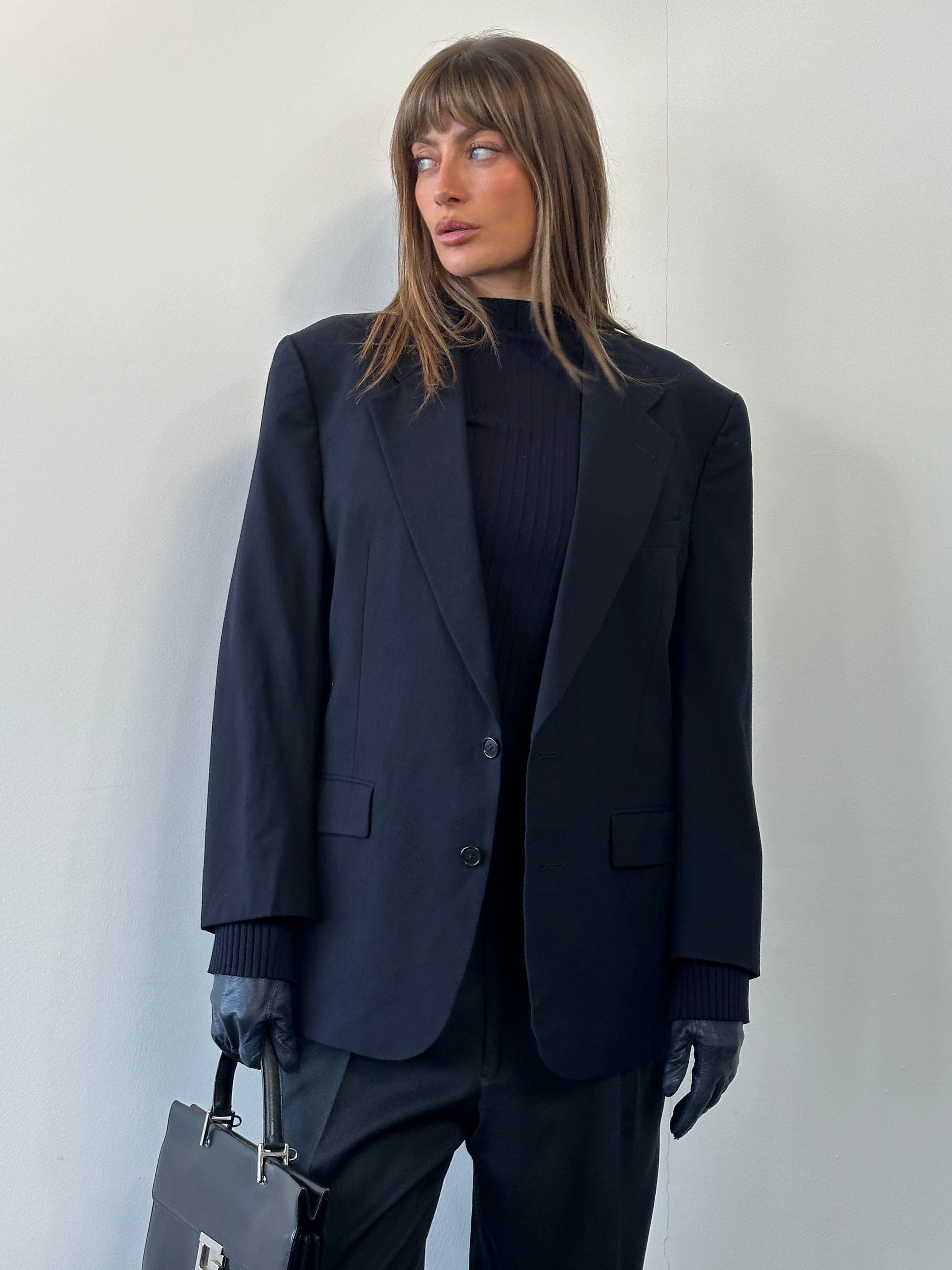 Christian Dior Monsieur 1980s pure wool single-breasted blazer in size 42S/L, shown on a hanger with a classic tailored fit.