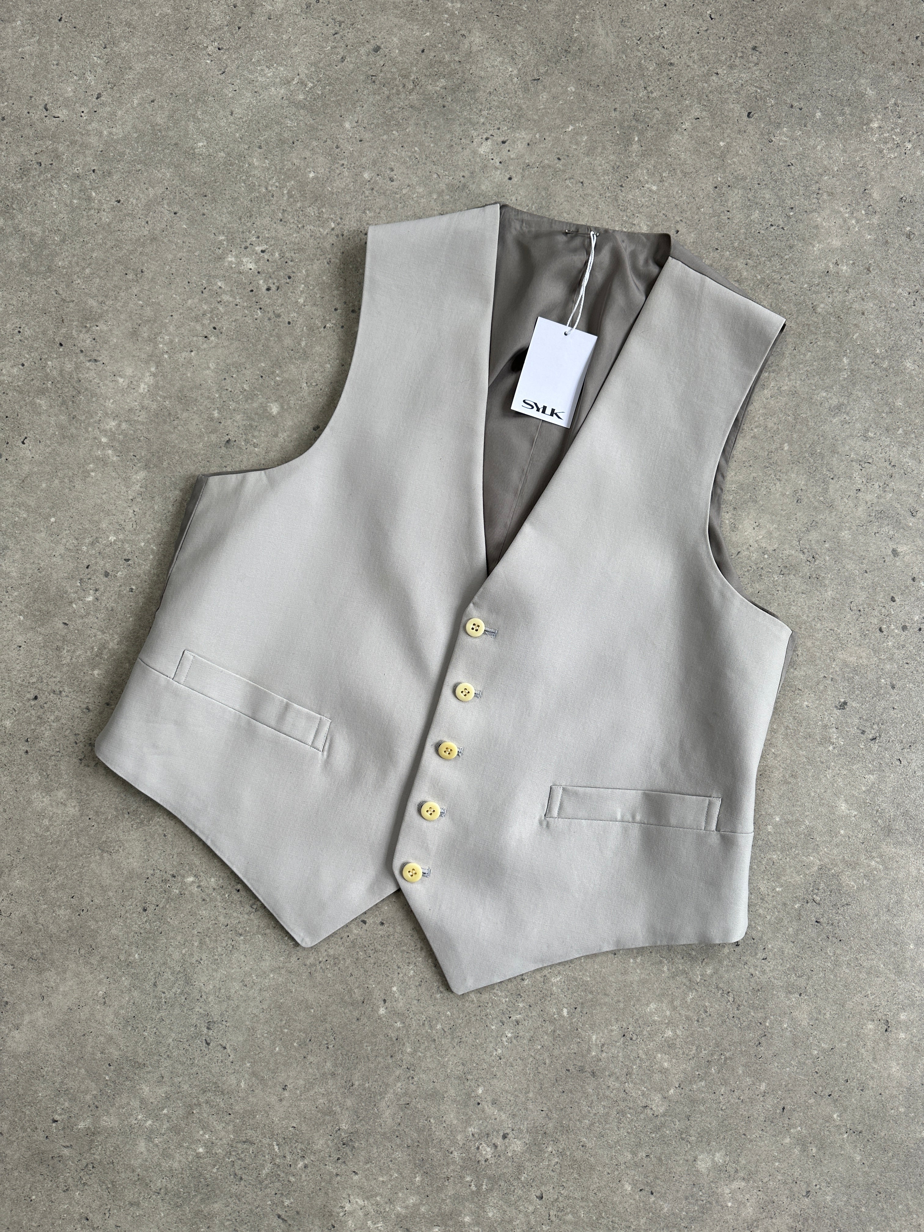 Vintage pure wool tailored waistcoat in size M/L, featuring classic design and detailed stitching, displayed on a neutral background.