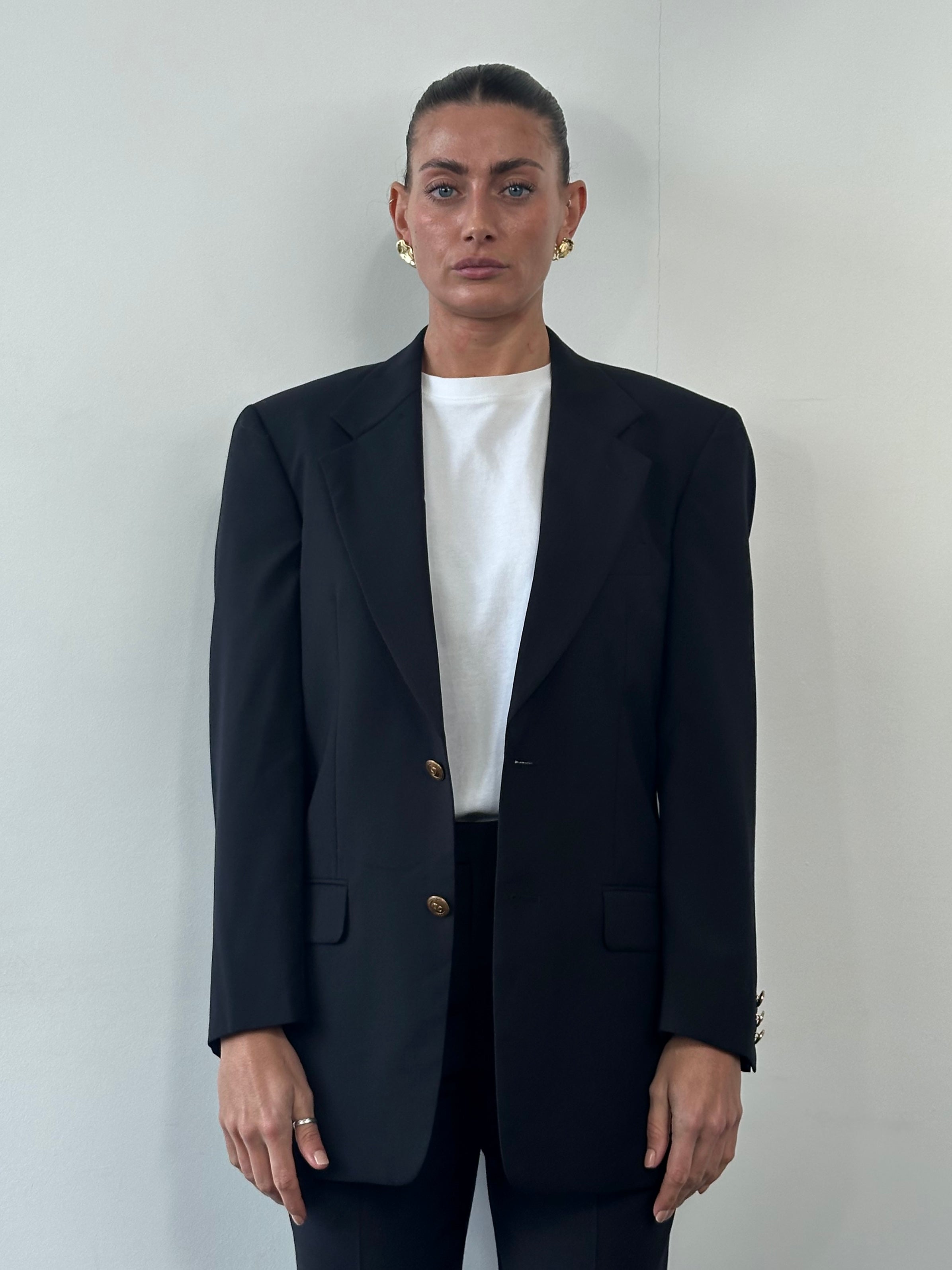 Valentino bespoke pure wool single-breasted blazer in size 36R/M, tailored fit with classic notch lapel and button closure.