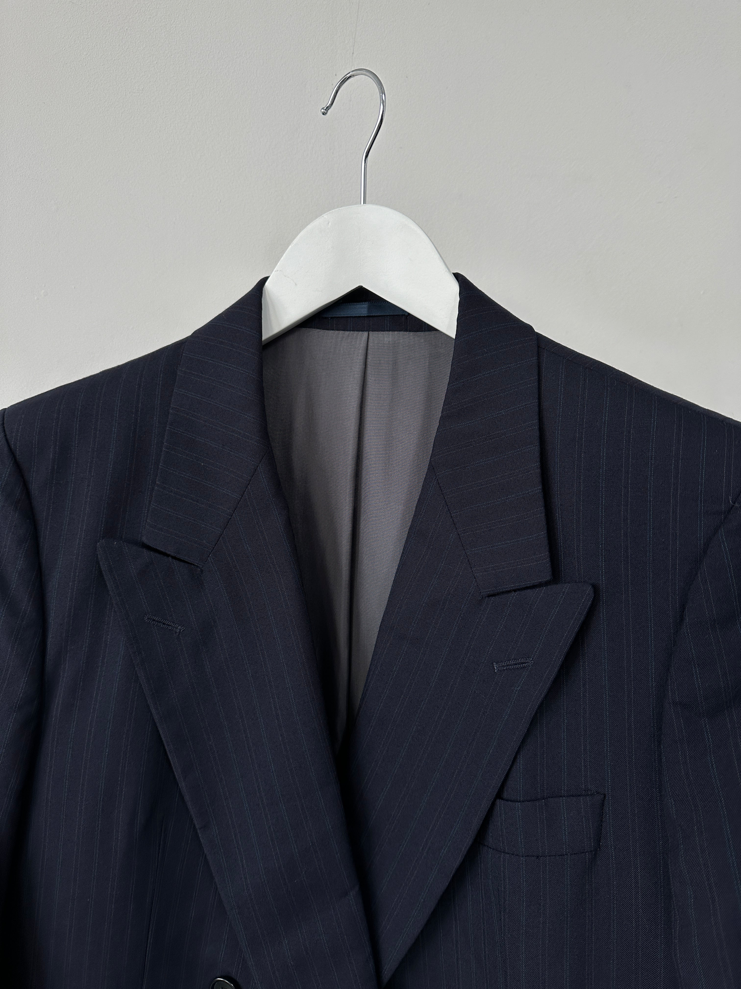 Hugo Boss pinstripe pure wool double-breasted blazer in size L, tailored with classic lapels and a structured fit.