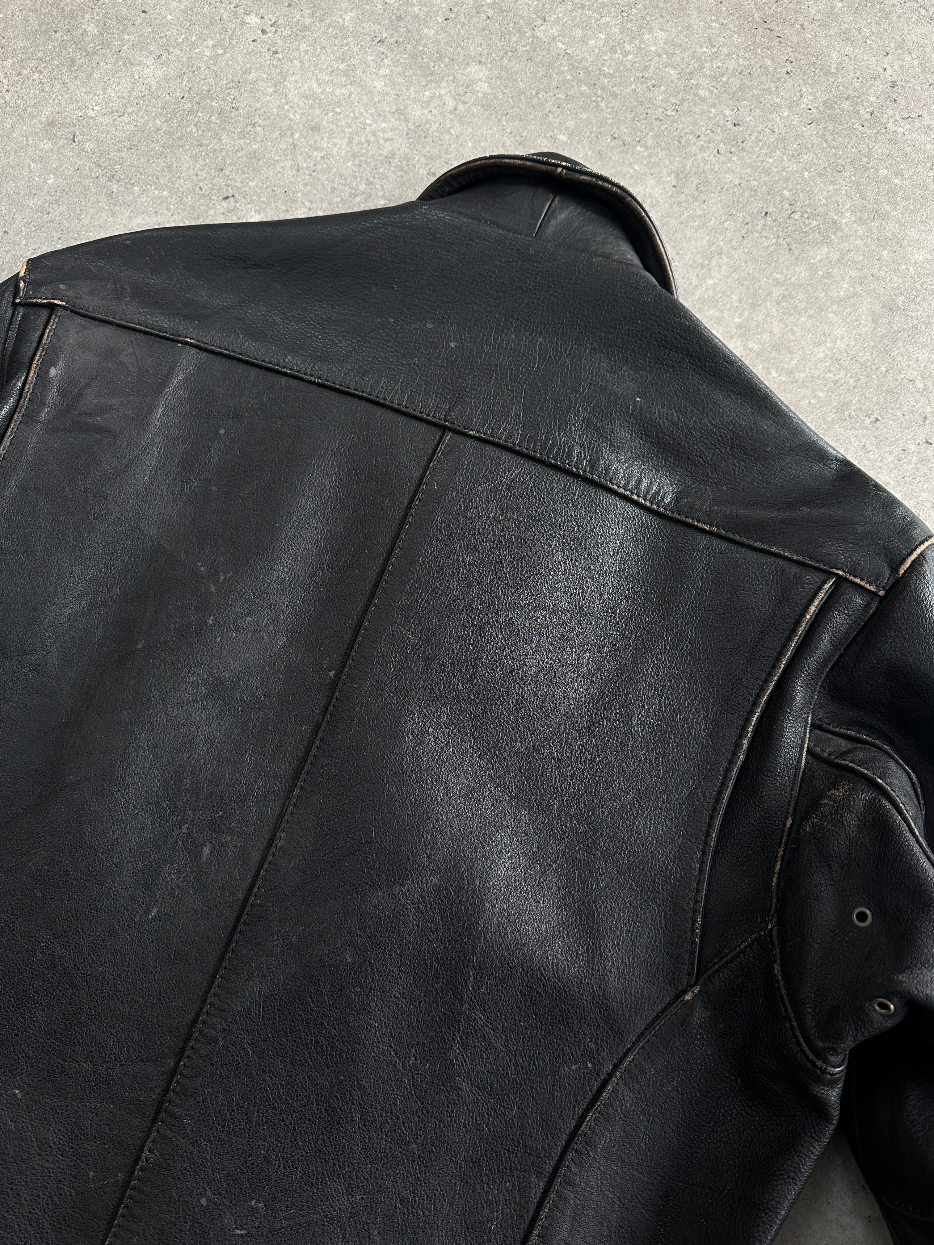 Vintage 1990s aged leather jacket, men's size M/L, with rugged distressed leather and classic style.