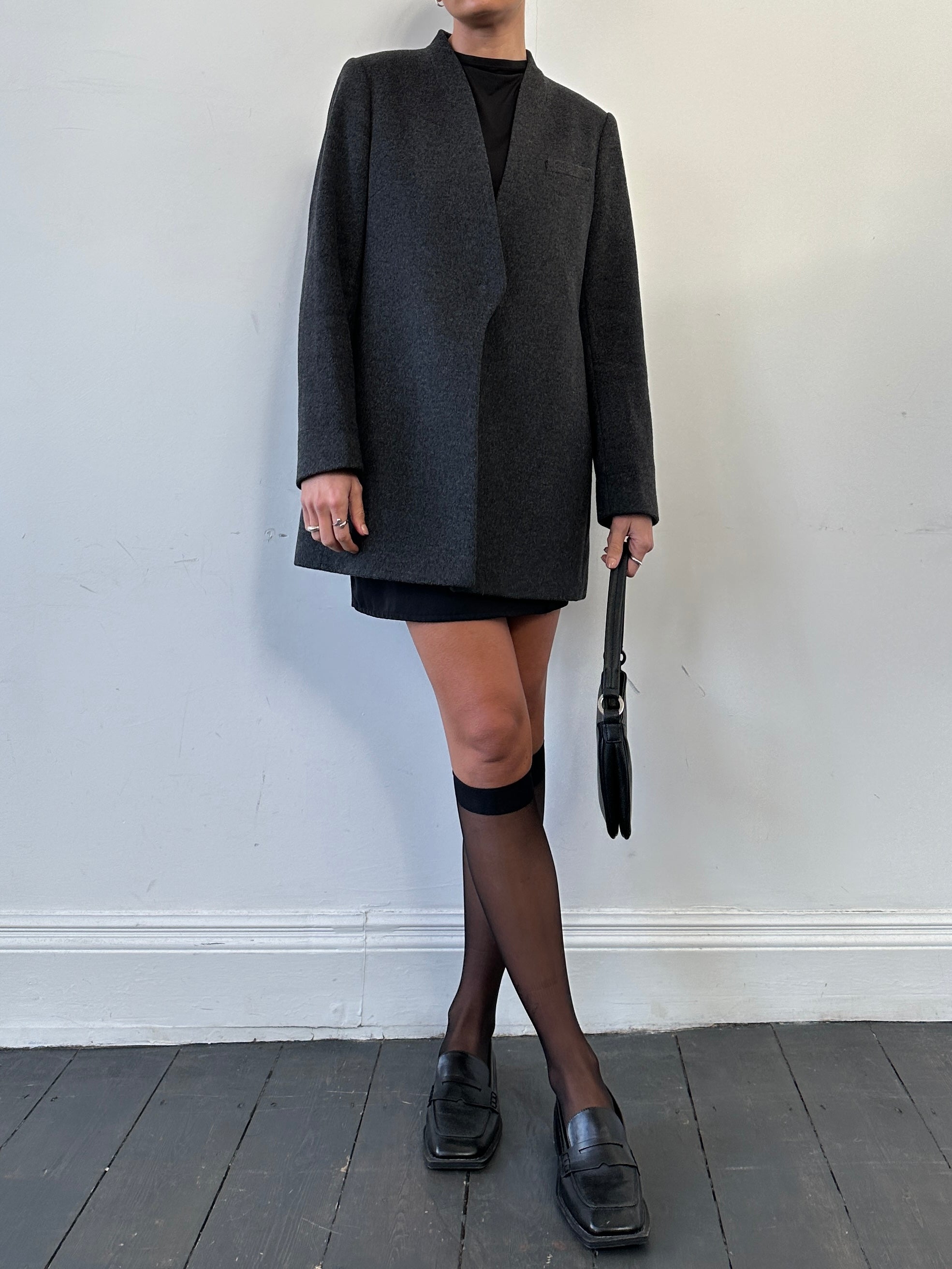 Jaeger minimal wool cashmere coat in size M, shown on a hanger, with clean lines and tailored fit in neutral color.