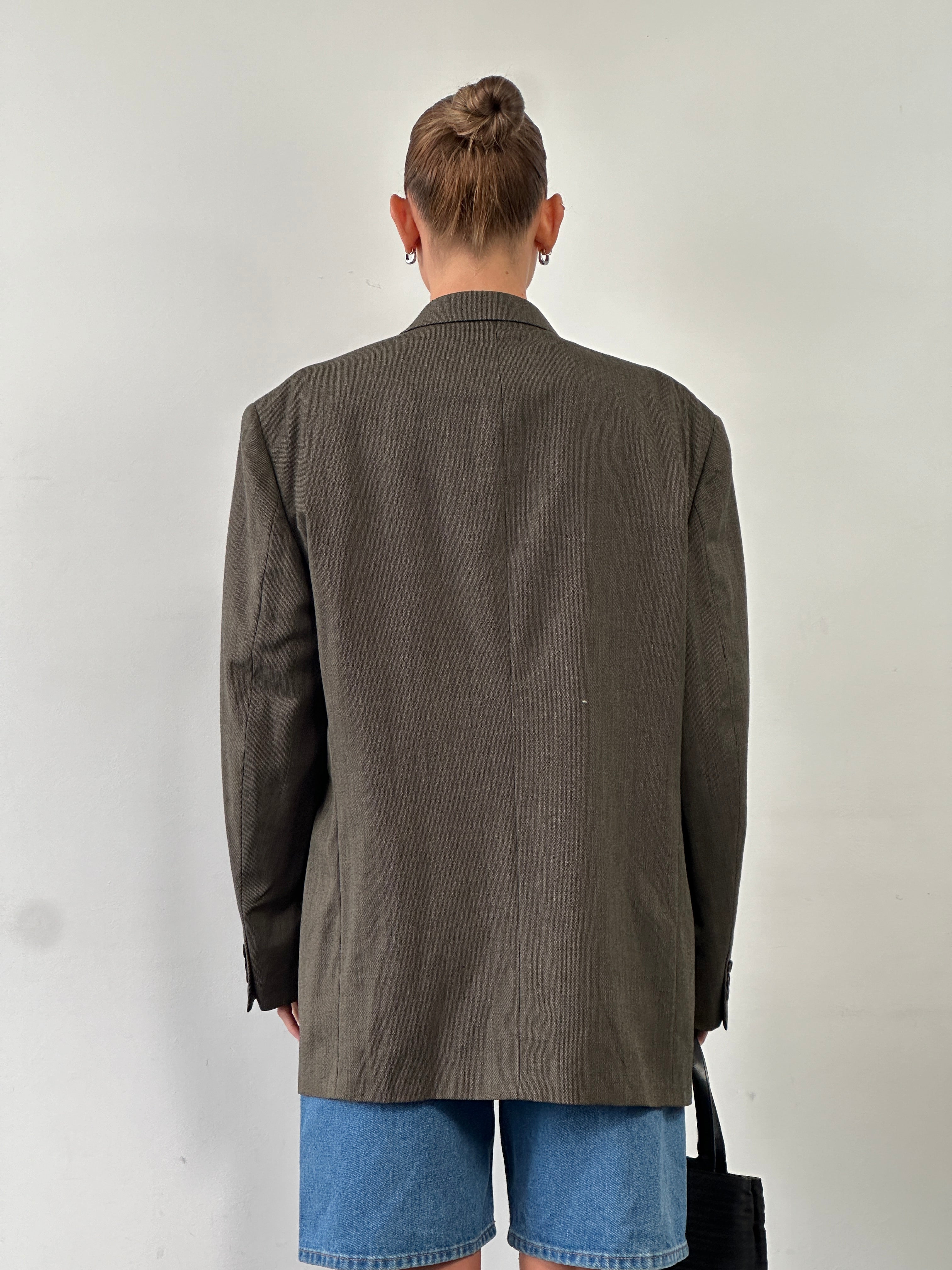 Givenchy Monsieur 90s pure wool single-breasted blazer in size 46R/XXL, tailored fit with classic lapels and button closure.
