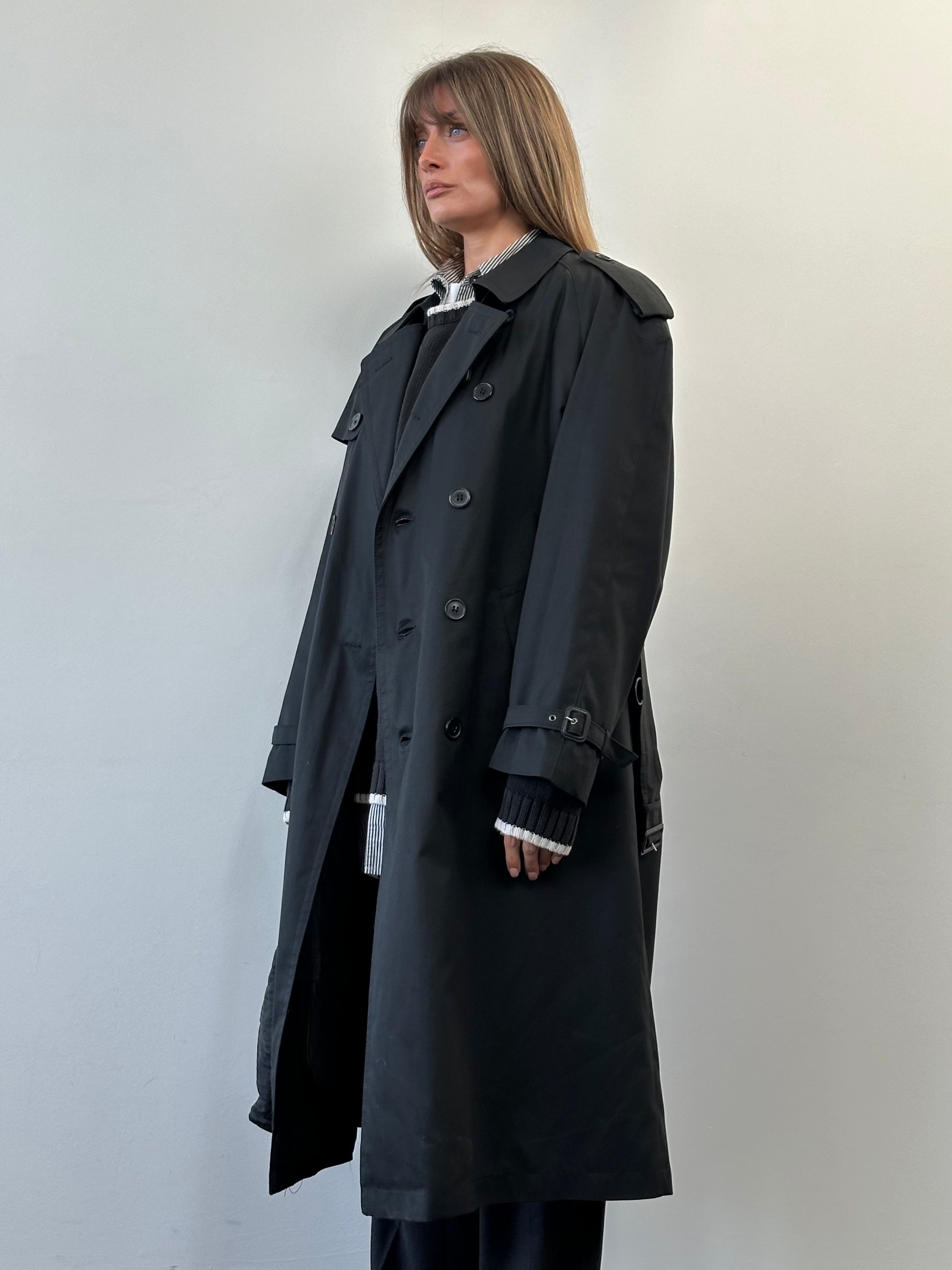 Vintage double-breasted belted trench coat in floor length style, shown in size XL with classic design and tailored fit.
