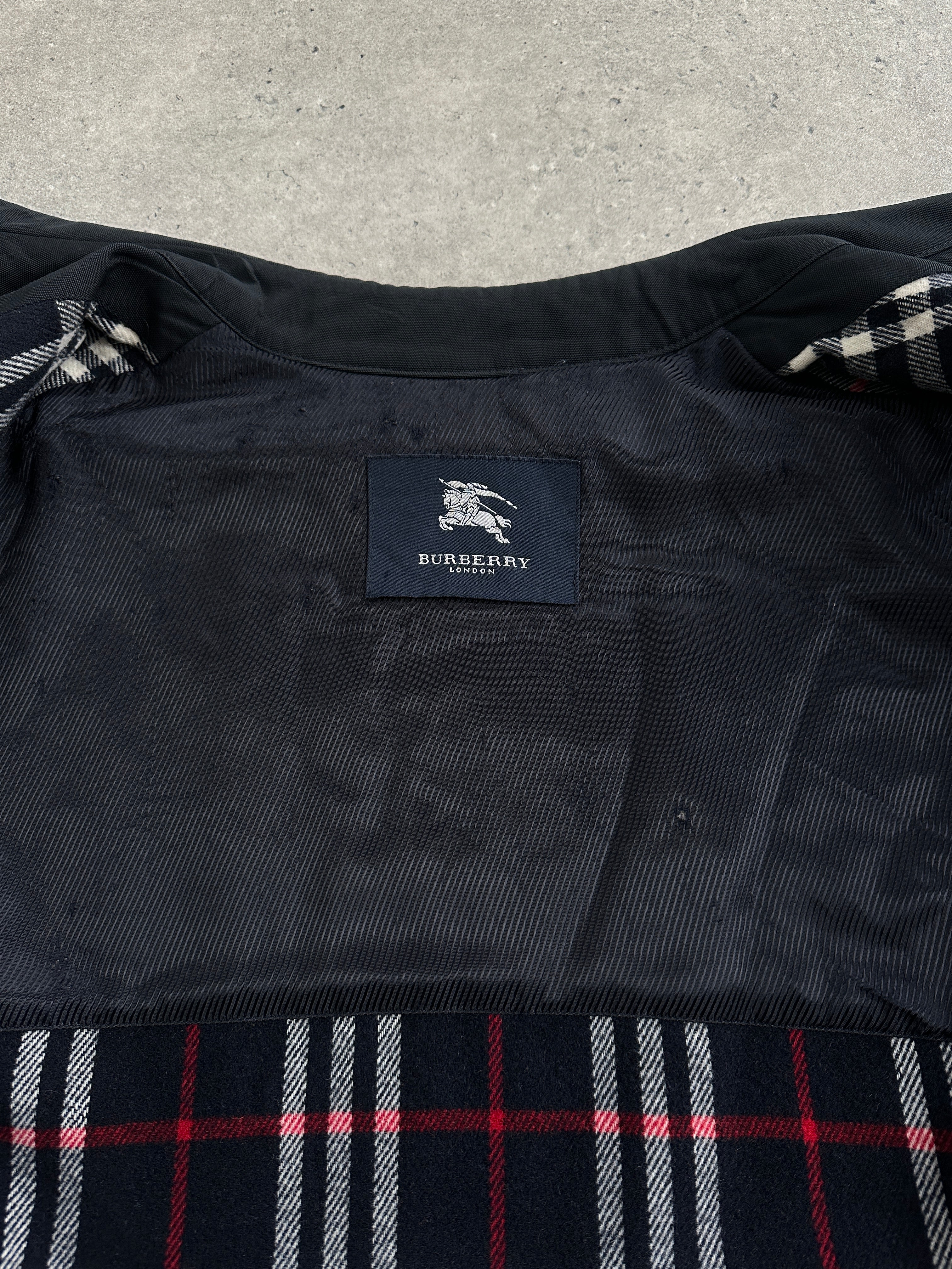 Burberry London 1990s waterproof Nova Check trench coat in XL/XXL, featuring classic check pattern and trench style.