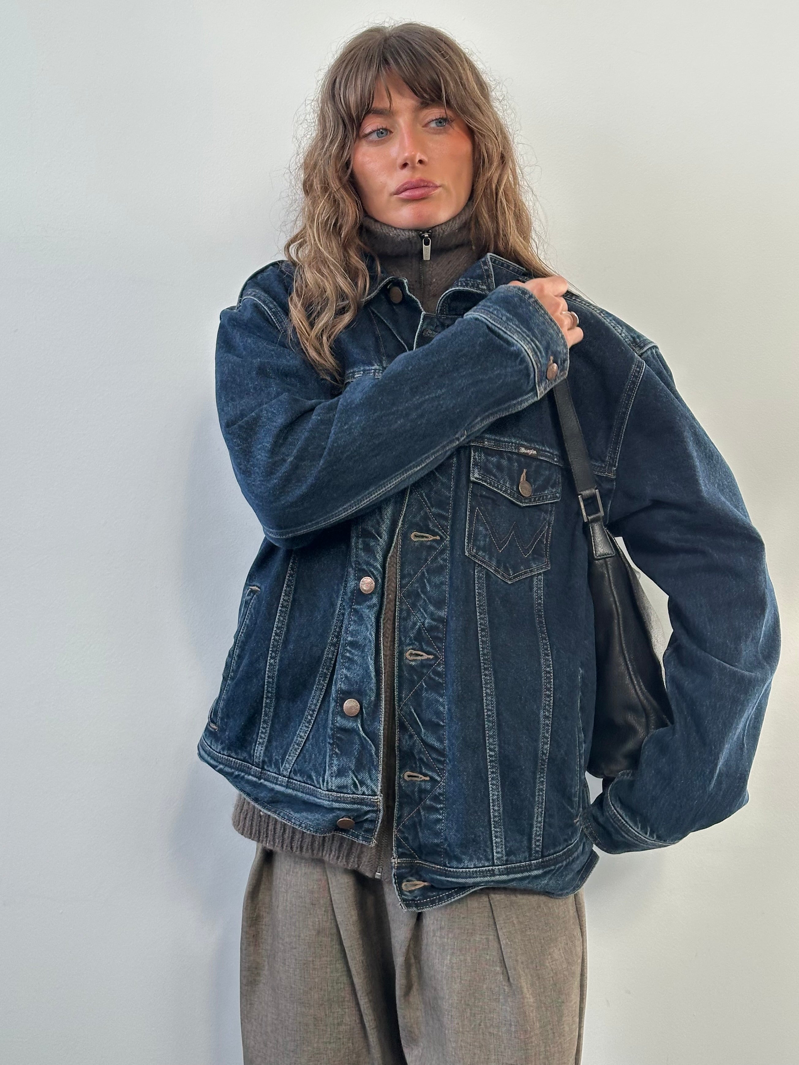 Wrangler 1990s mid wash denim jacket in XL, showing classic collar, button front, and long sleeves on a plain background.