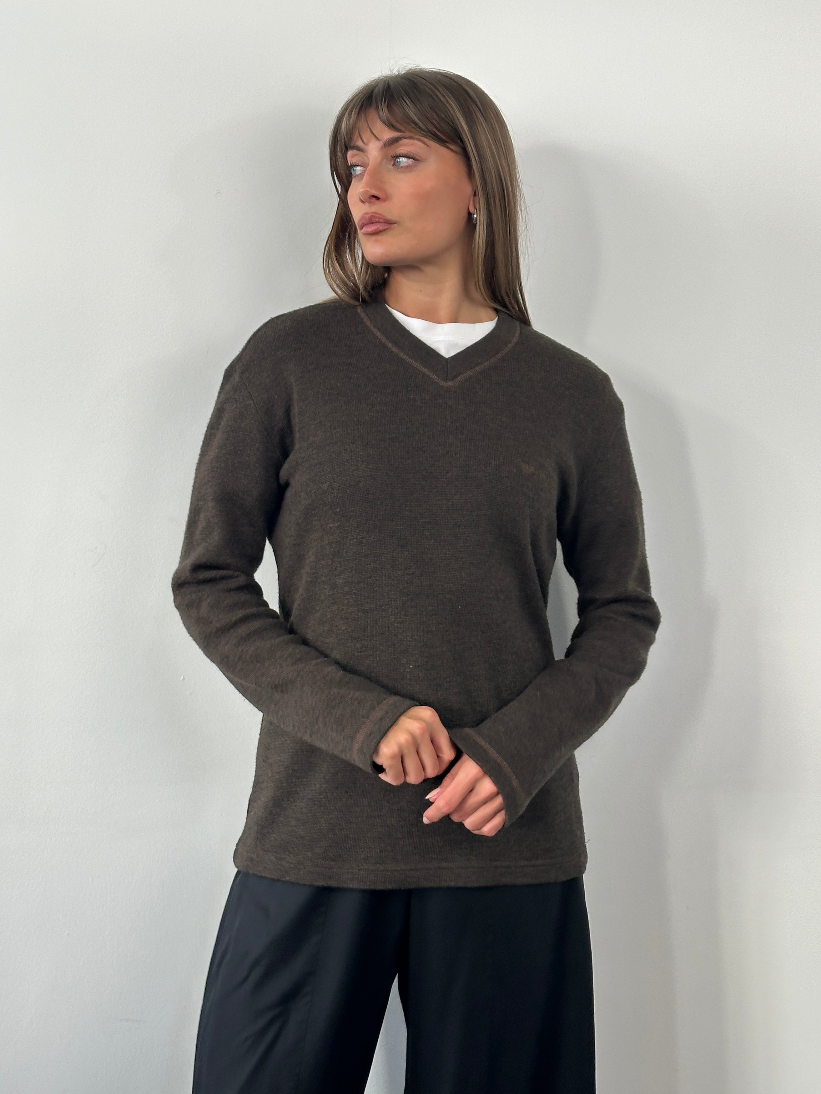 Armani Jeans 2000s wool V-neck knitted jumper in size M, featuring the brand's logo, soft fabric, and classic design.