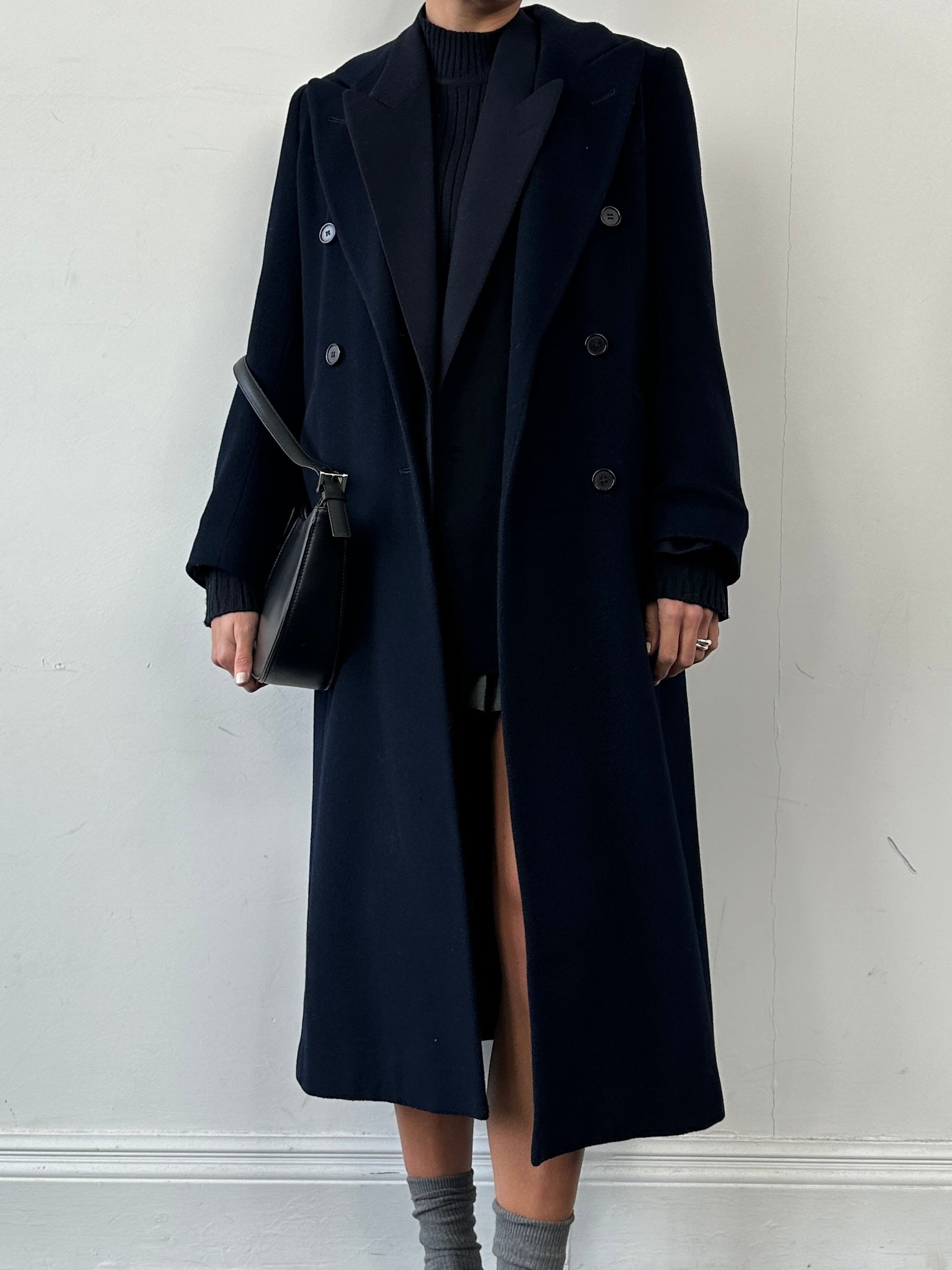 Vintage wool and cashmere double-breasted coat in size small, featuring classic design and warm fabric, displayed on a hanger.