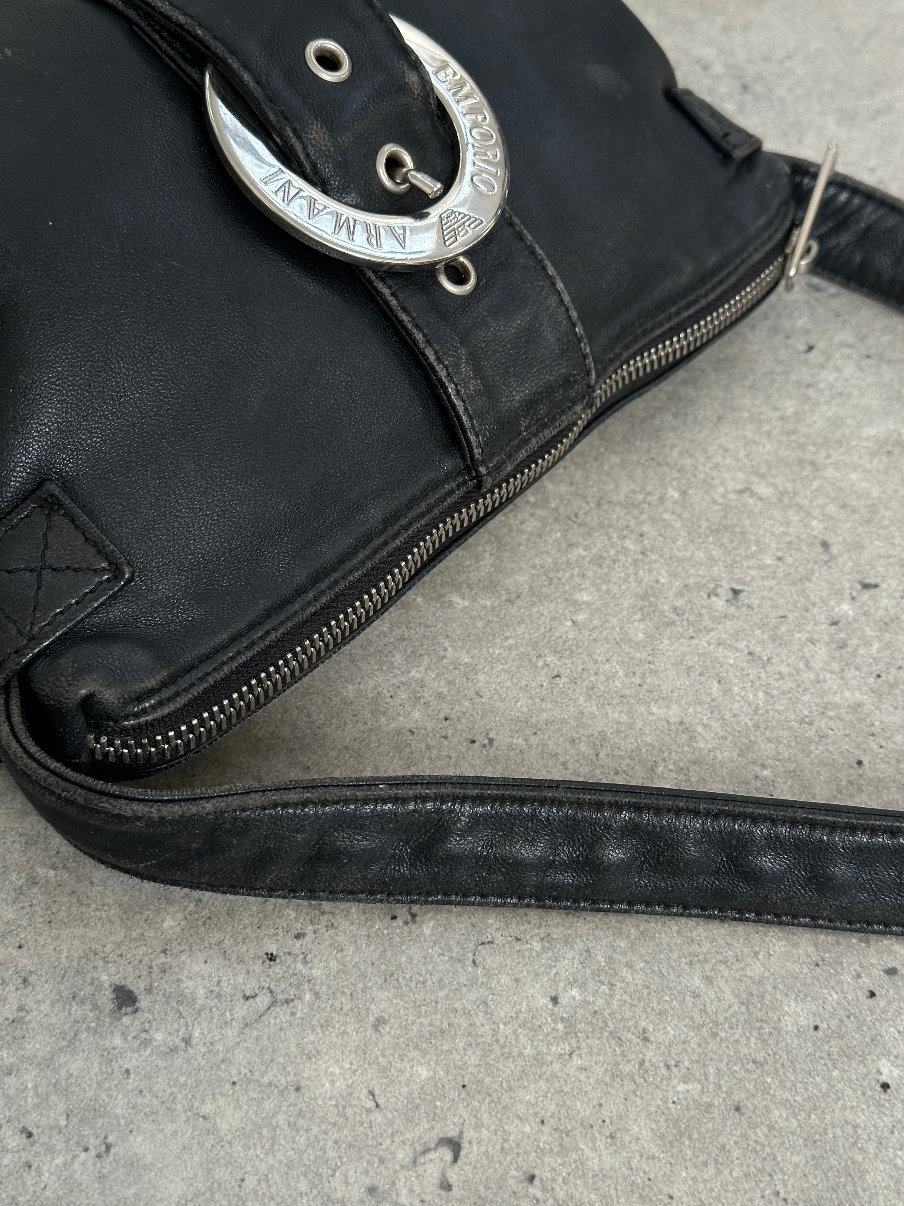 Emporio Armani 2000s aged leather shoulder bag with sleek design and classic logo, featuring a structured silhouette and subtle hardware.