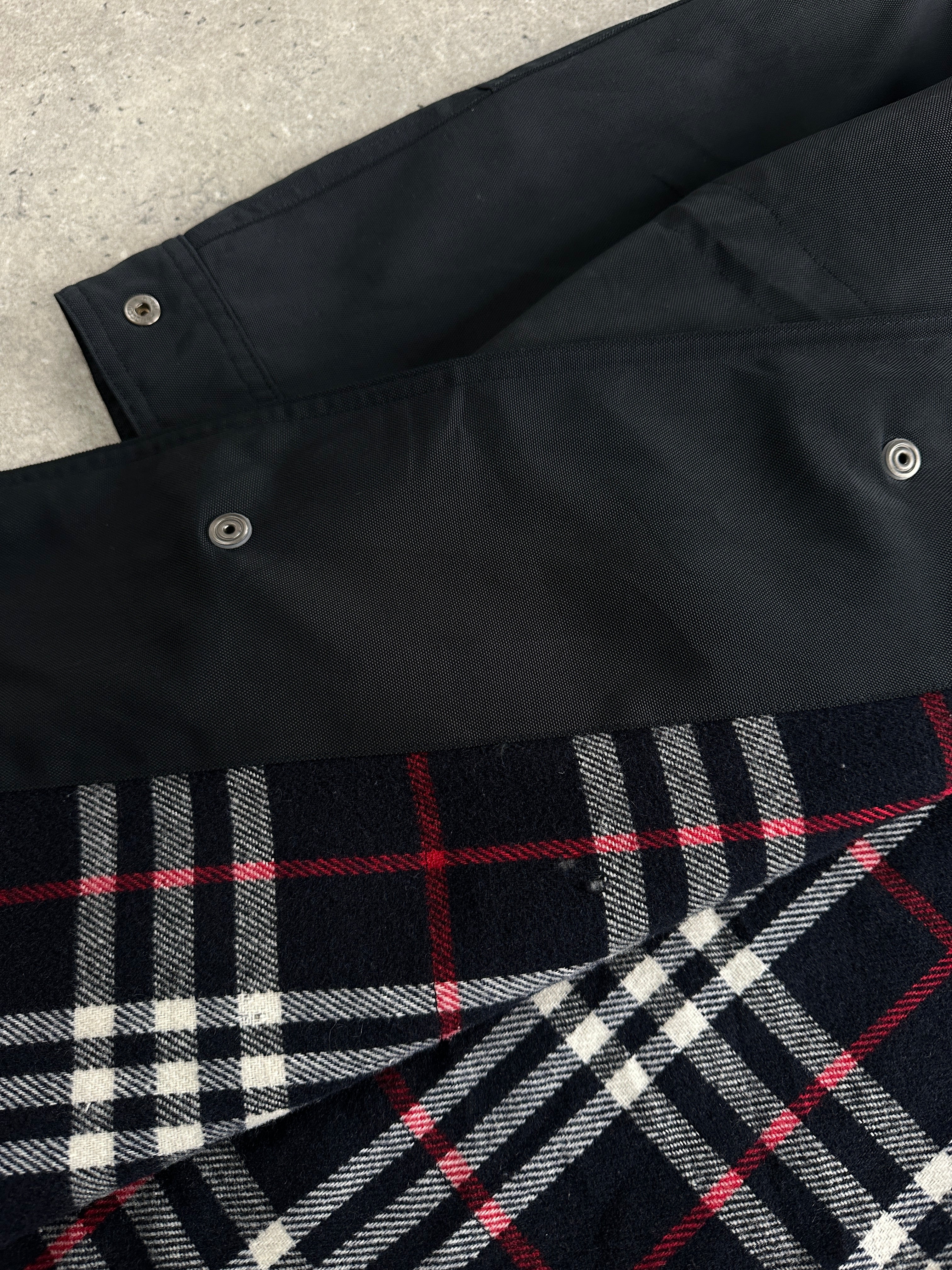Burberry London 1990s waterproof Nova Check trench coat in XL/XXL, shown with classic check pattern and belted waist.