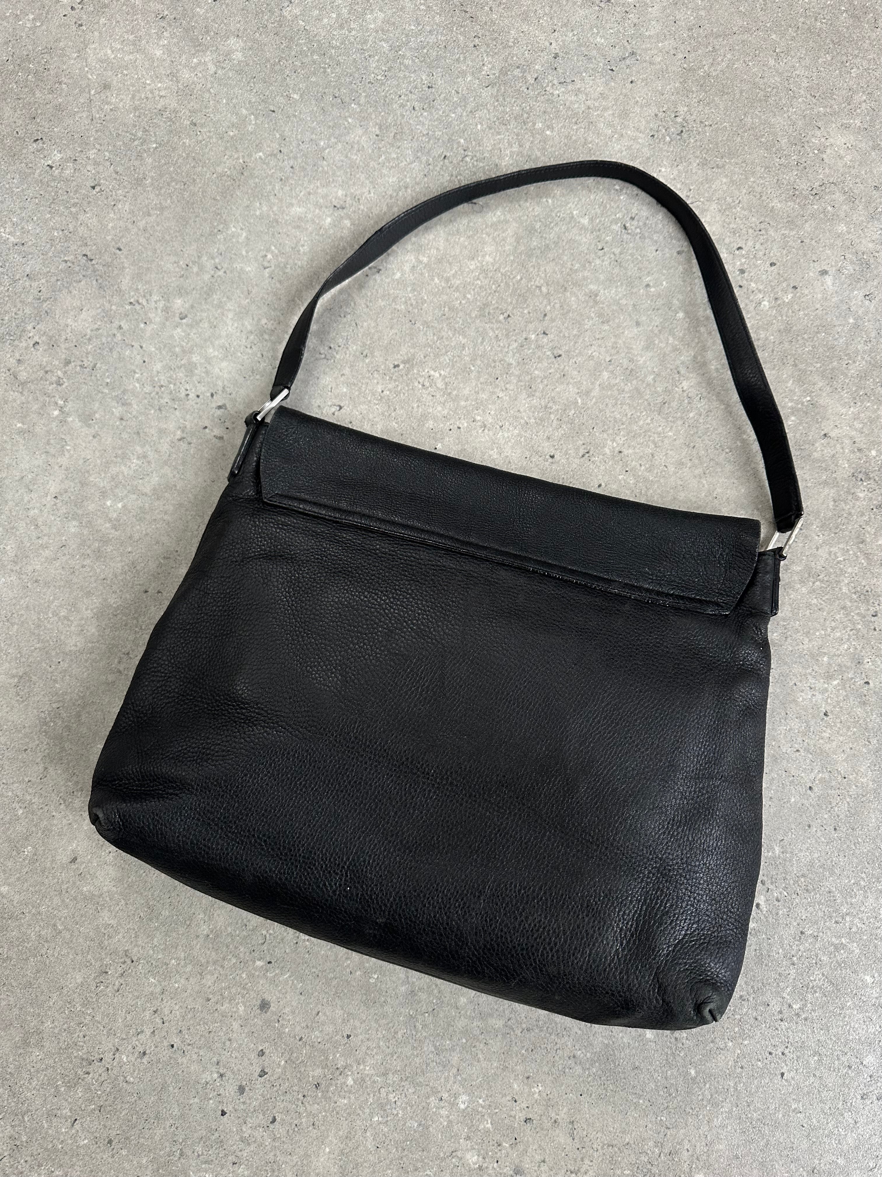 Giorgio Armani 2000s leather crossbody bag with adjustable strap and sleek design, featuring signature Armani branding.