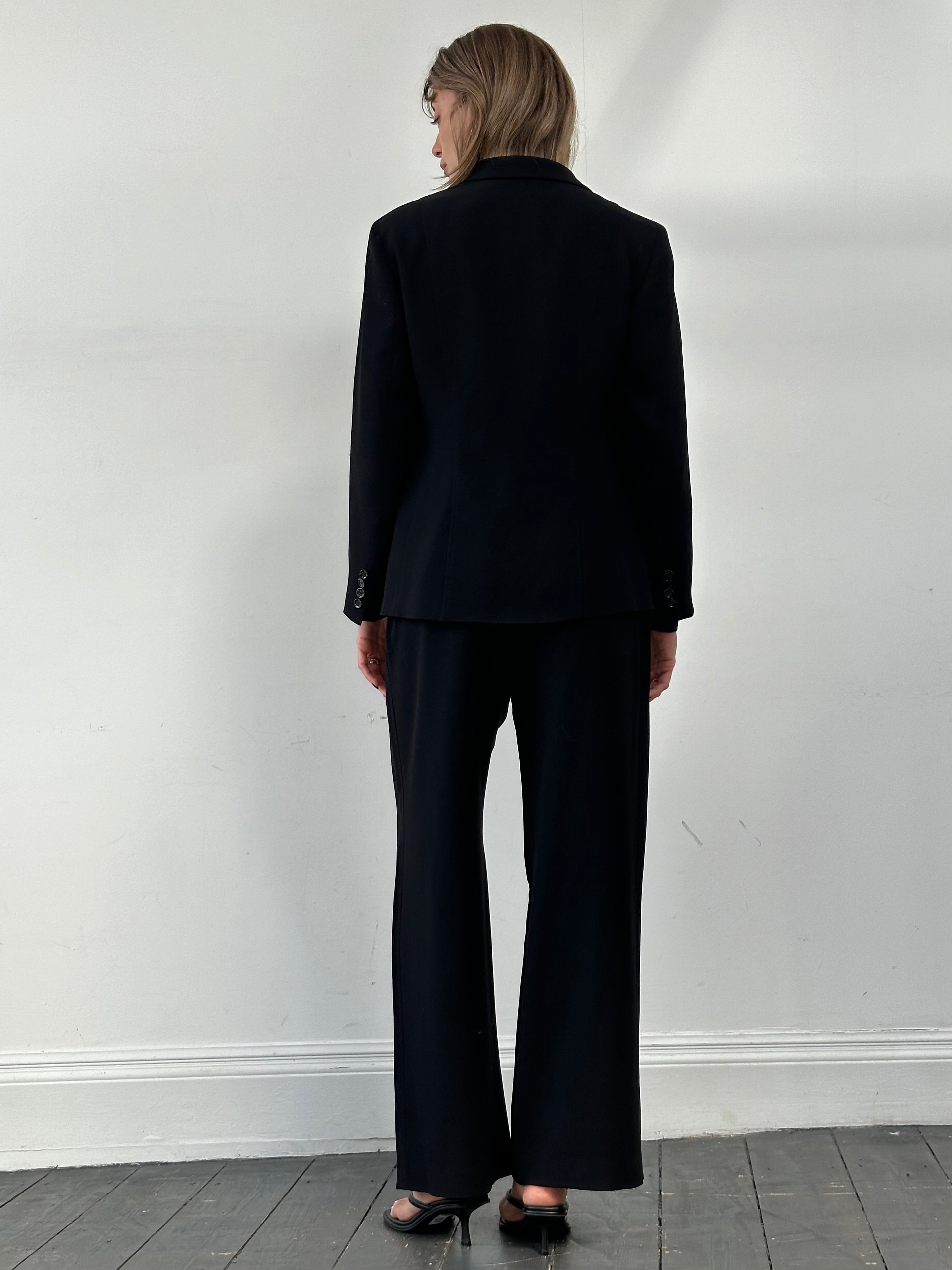 Max Mara minimal single-breasted jumpsuit in sleek fabric, featuring a tailored fit and classic design.