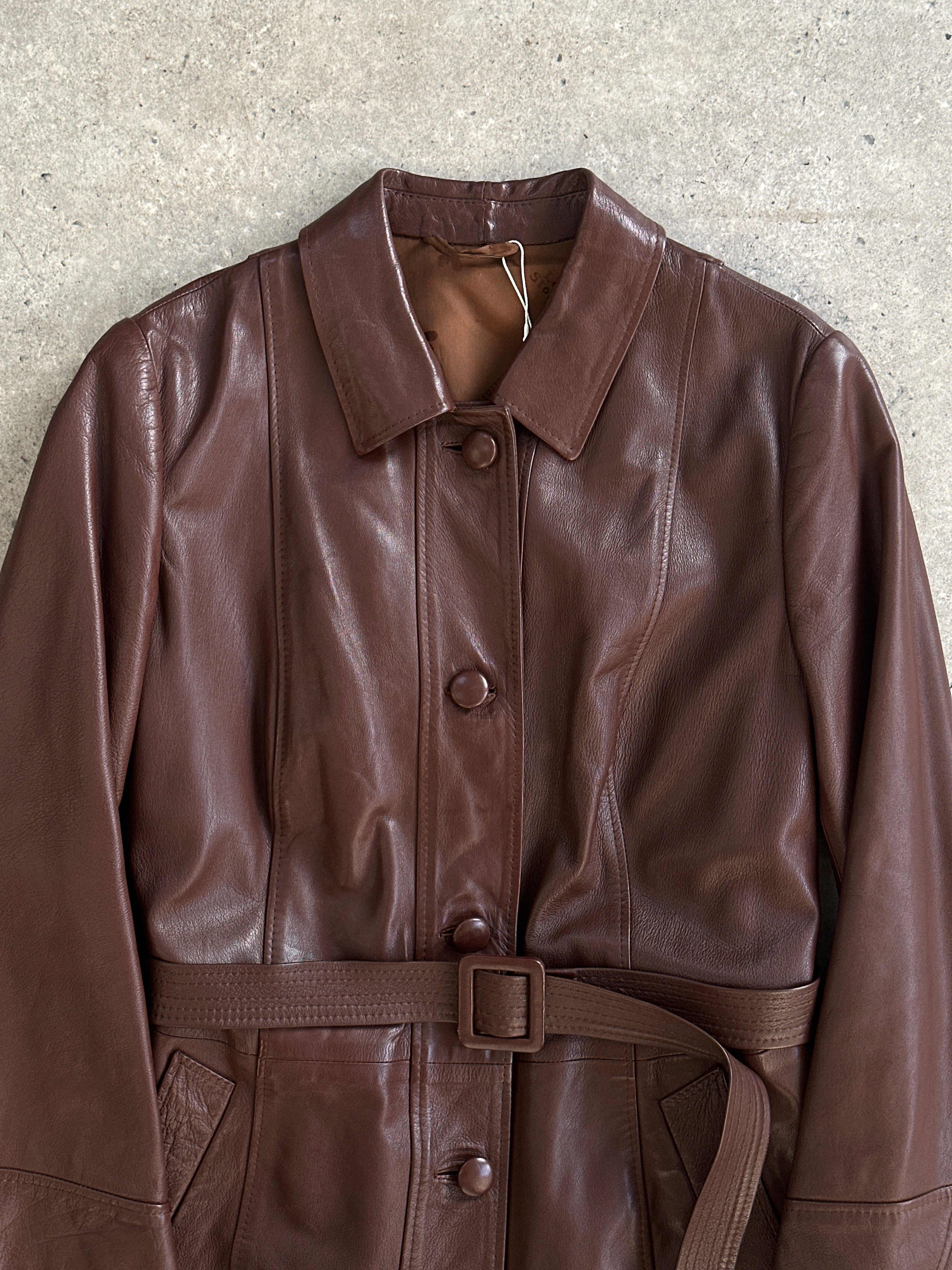 Vintage smooth leather belted trench coat jacket in size M/L, featuring classic design and stylish details.