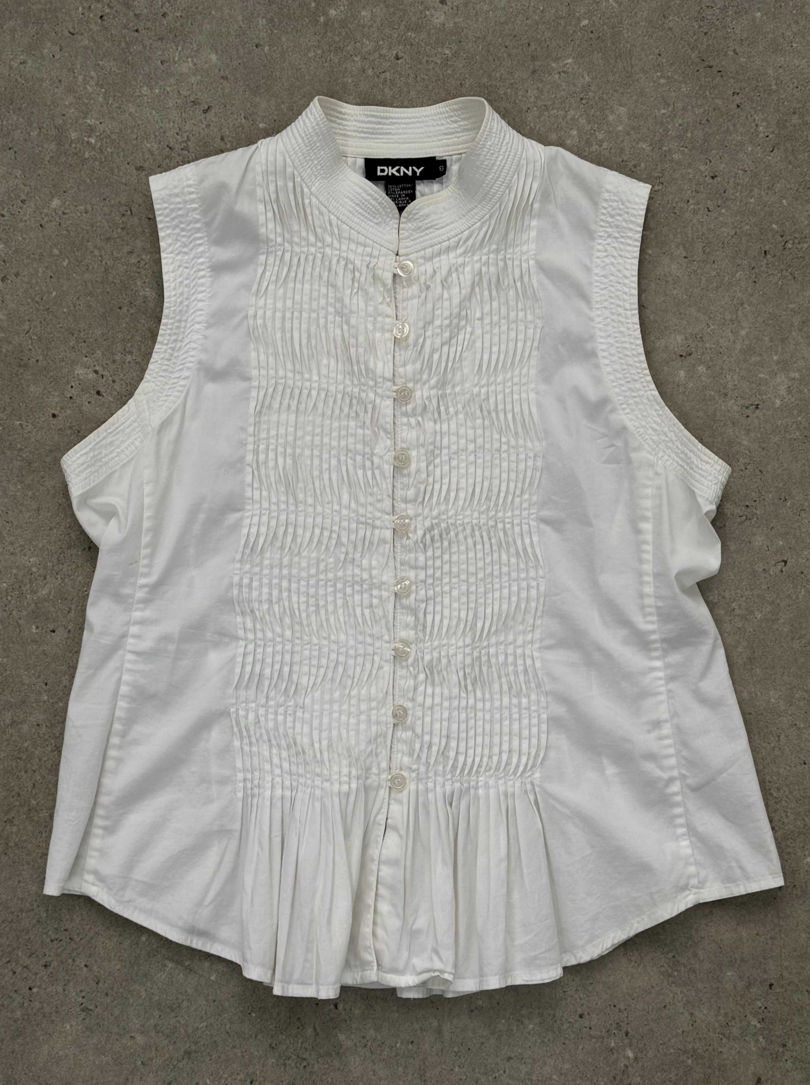 DKNY 2000s pleated sleeveless cotton top in size M, featuring a classic design with pleats and a sleeveless silhouette.