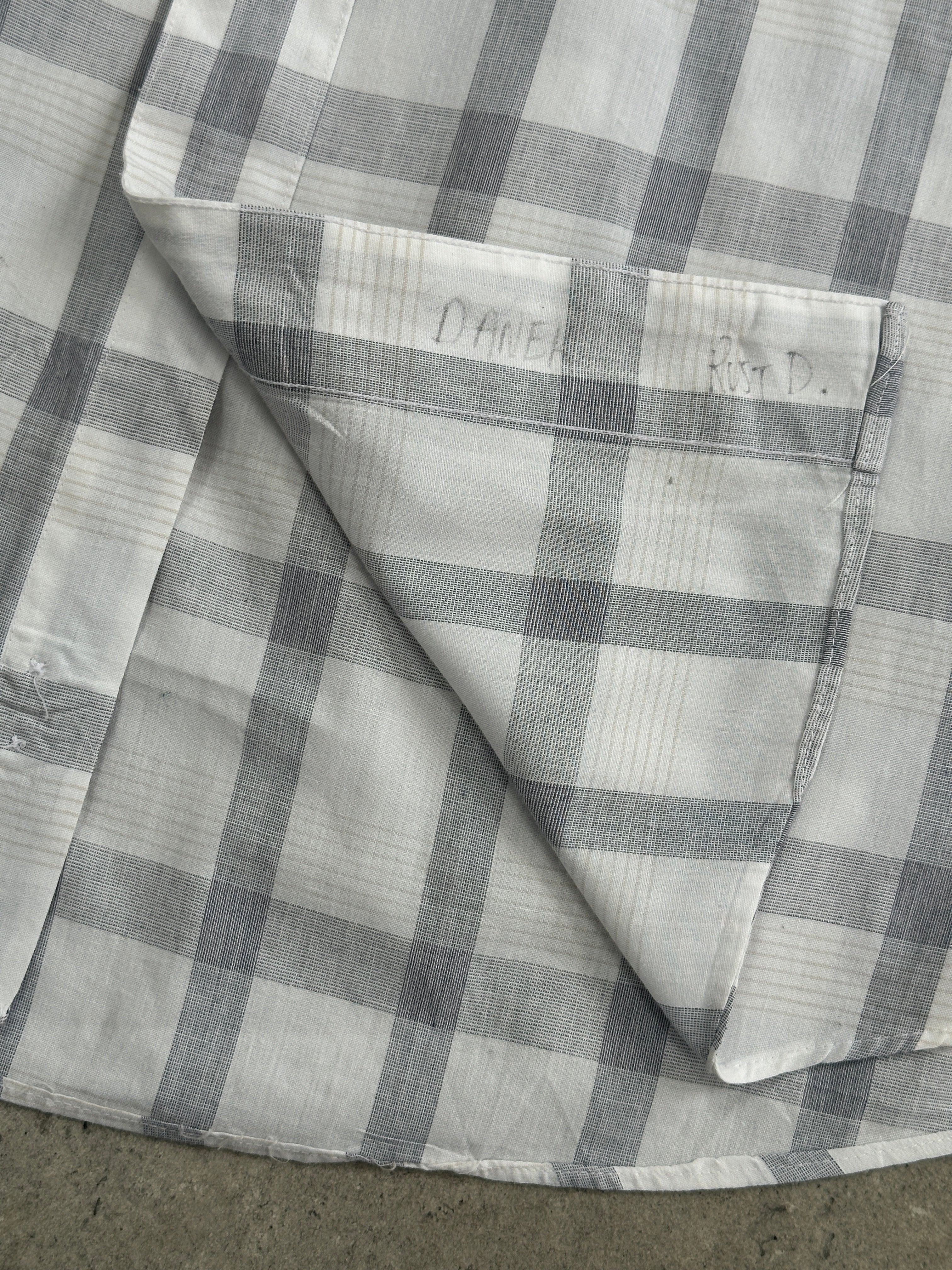 Christian Dior 1990s check cotton shirt in XL, showing the classic plaid pattern and tailored fit with button-down front.