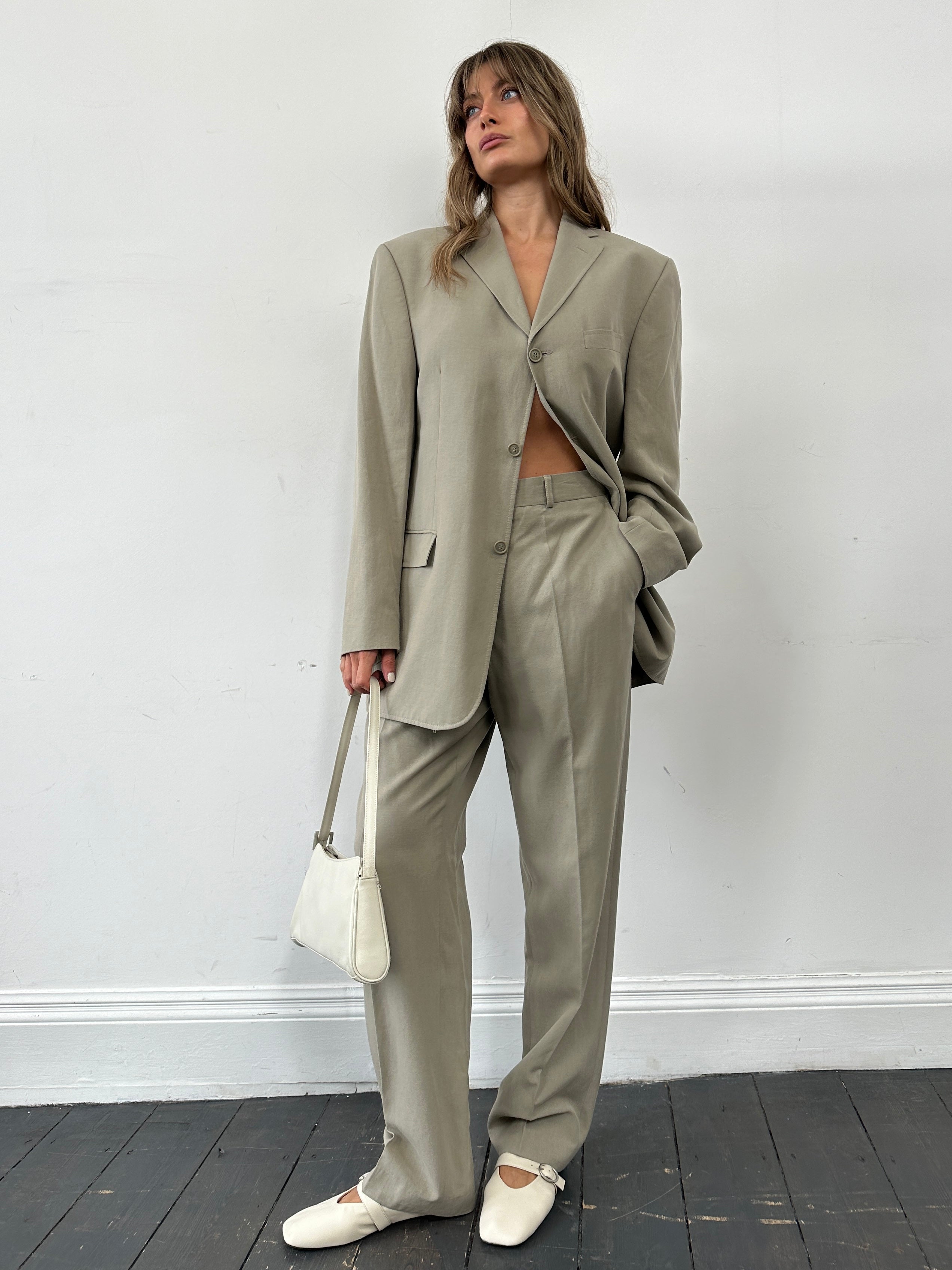 Pierre Cardin lyocell jumpsuit in size 42R/W34, single-breasted design, shown on model with front view.
