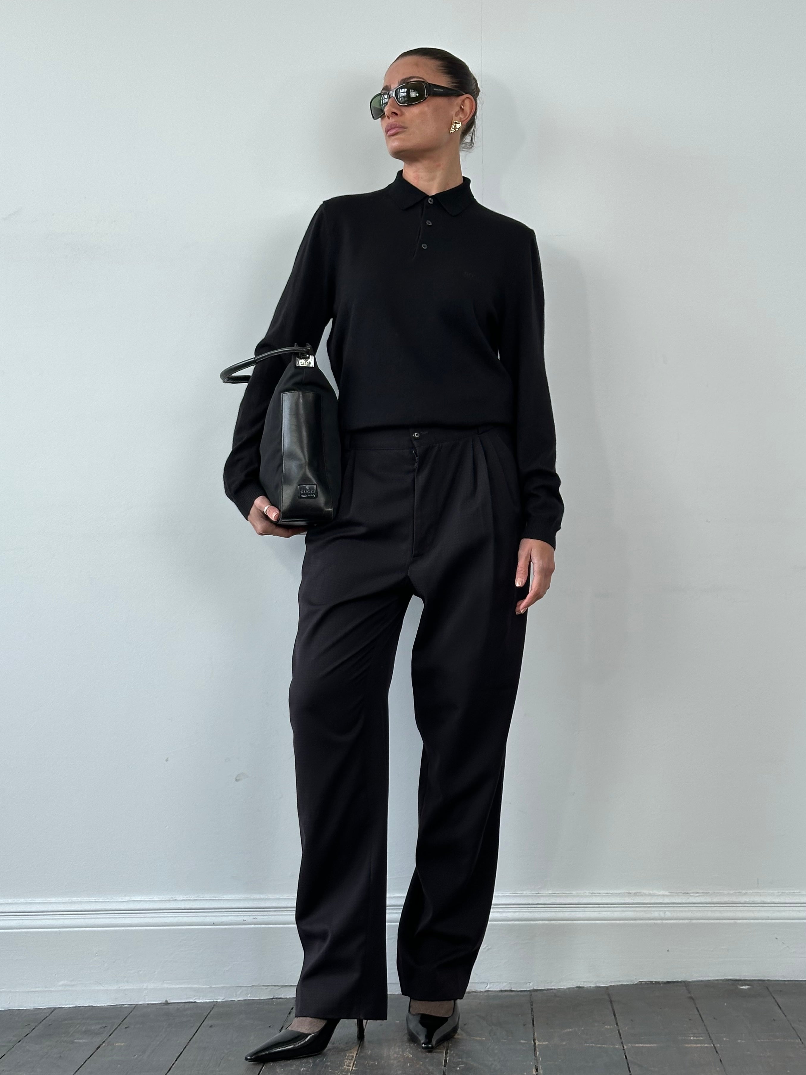 Versace 80s pure wool tapered leg trousers in dark color, tailored fit with belt loops and classic design.