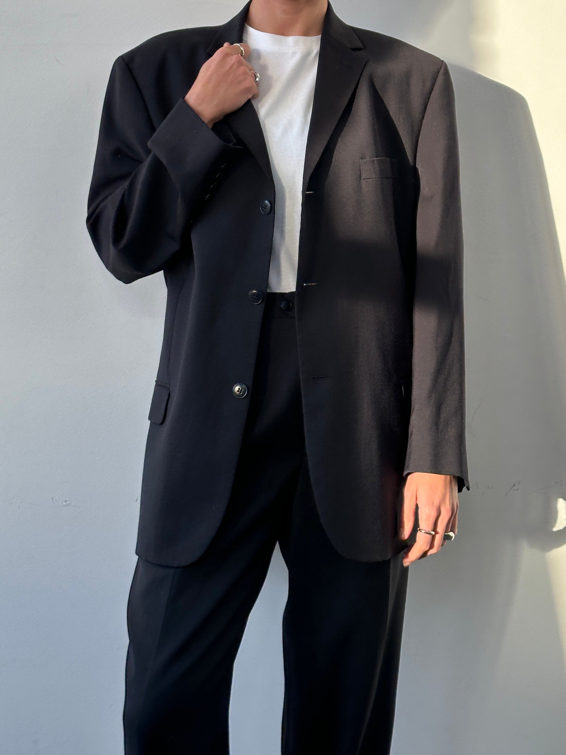 Pierre Cardin pure wool single-breasted suit jumpsuit in size 44S/W32, tailored fit with classic lapel and button closure.