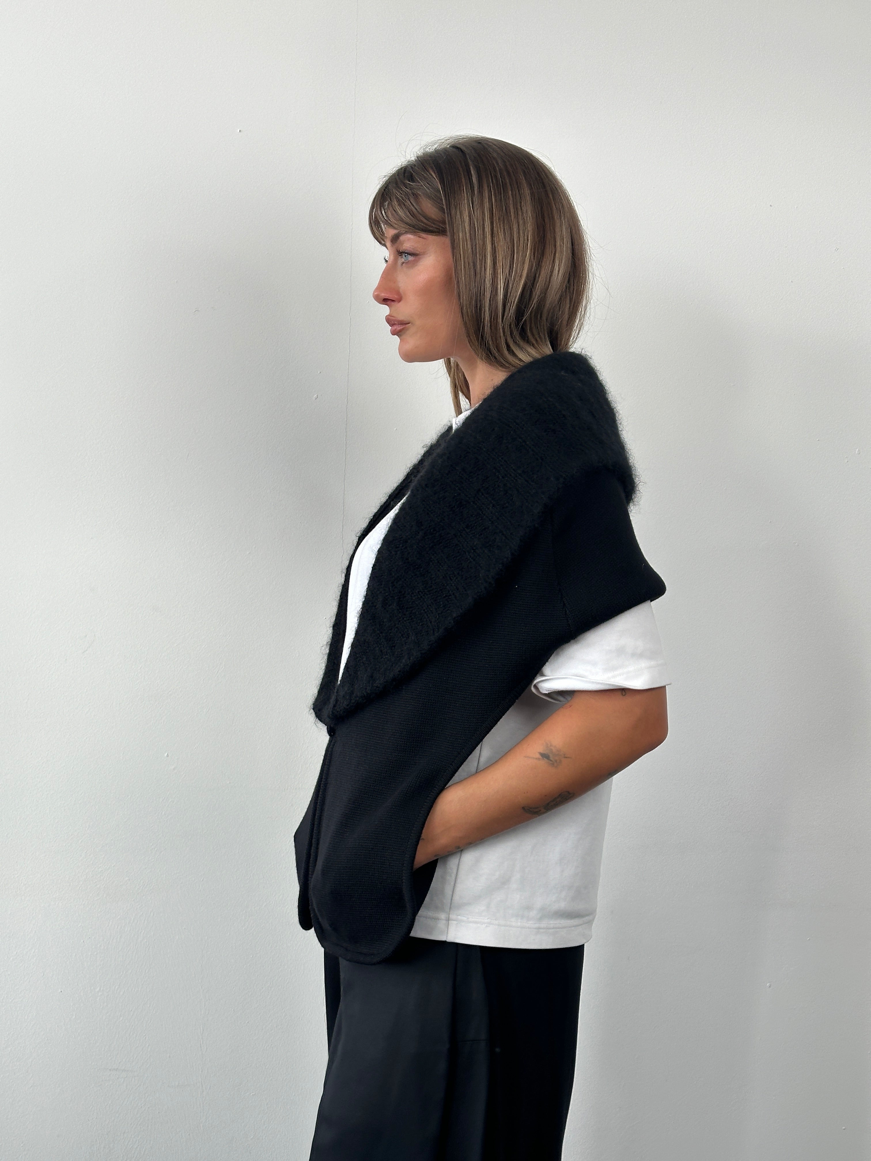 Elegant Italian vintage 1990s Armani merino wool knitted shawl scarf with intricate patterns and soft texture.