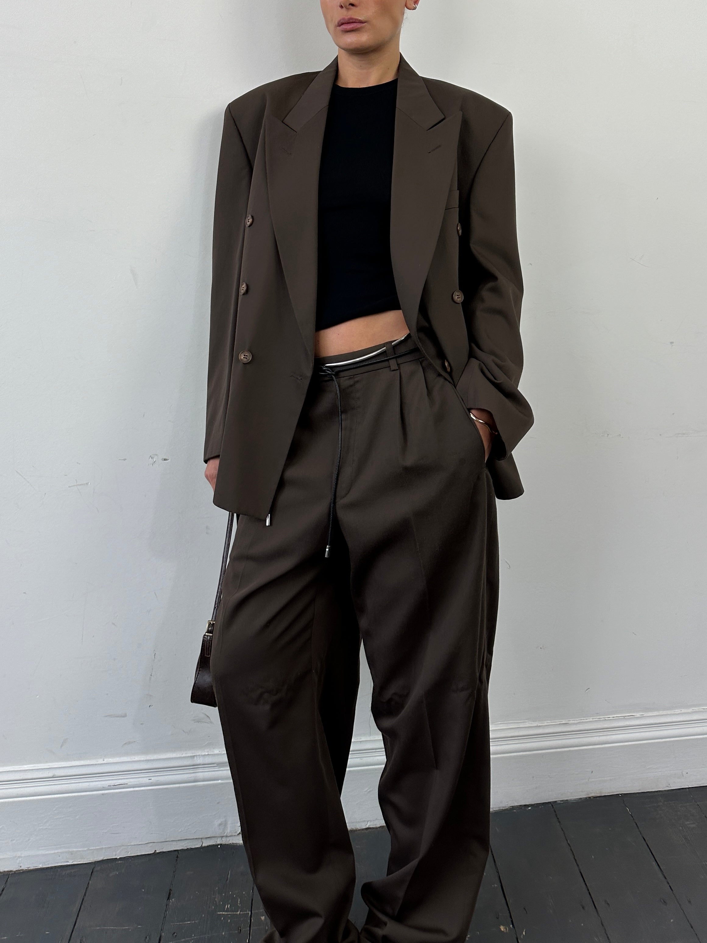 Vintage double-breasted jumpsuit in size 40R/W32, featuring classic style and tailored fit, displayed on a plain background.