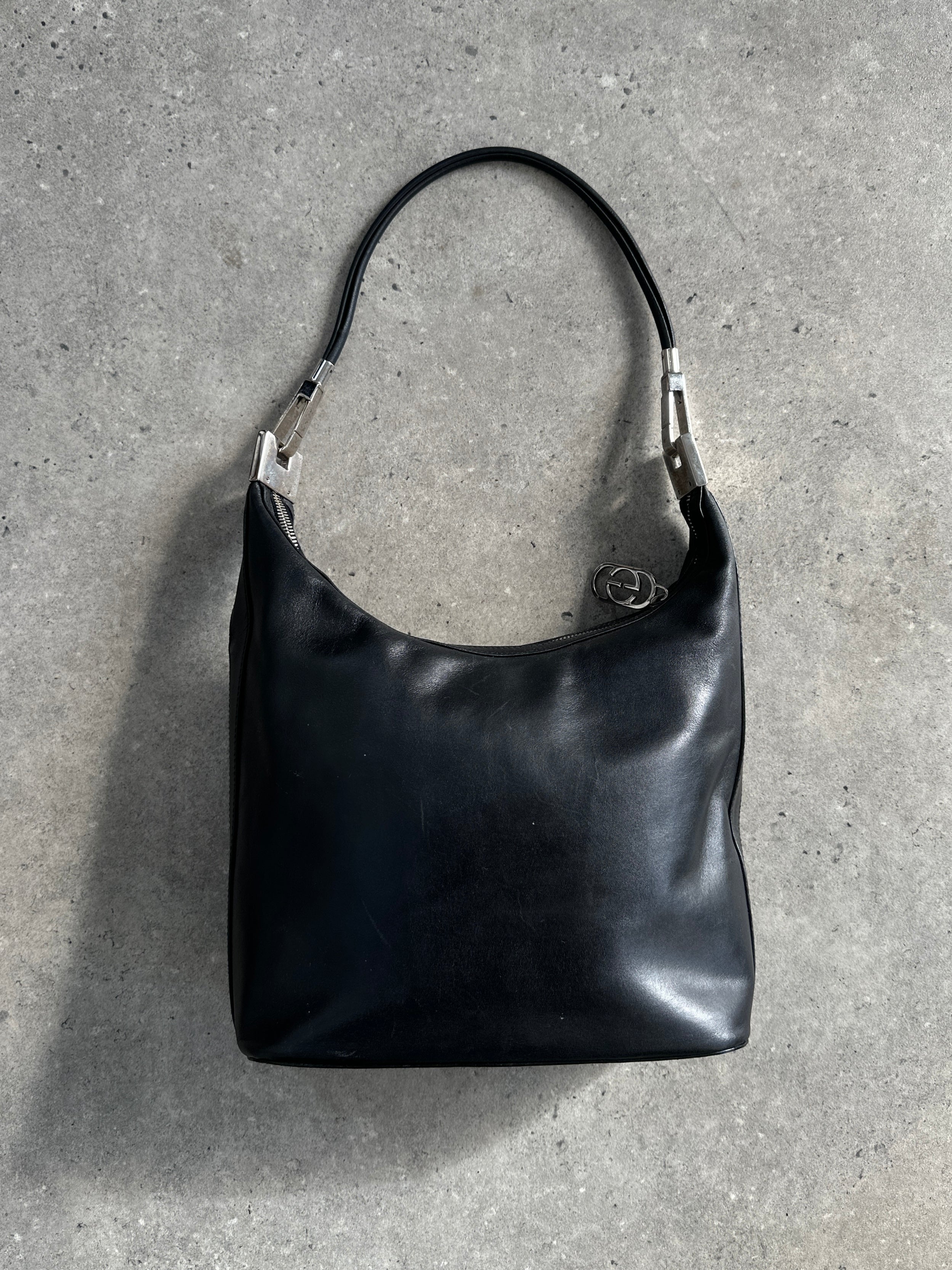 Gucci 1990s Tom Ford GG leather hobo shoulder bag with slouchy design and logo details.