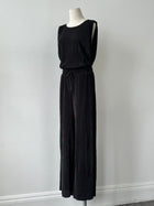 DKNY 2000s pleated wide-leg two-piece set, featuring a sleeveless top and matching pants in a vintage style.
