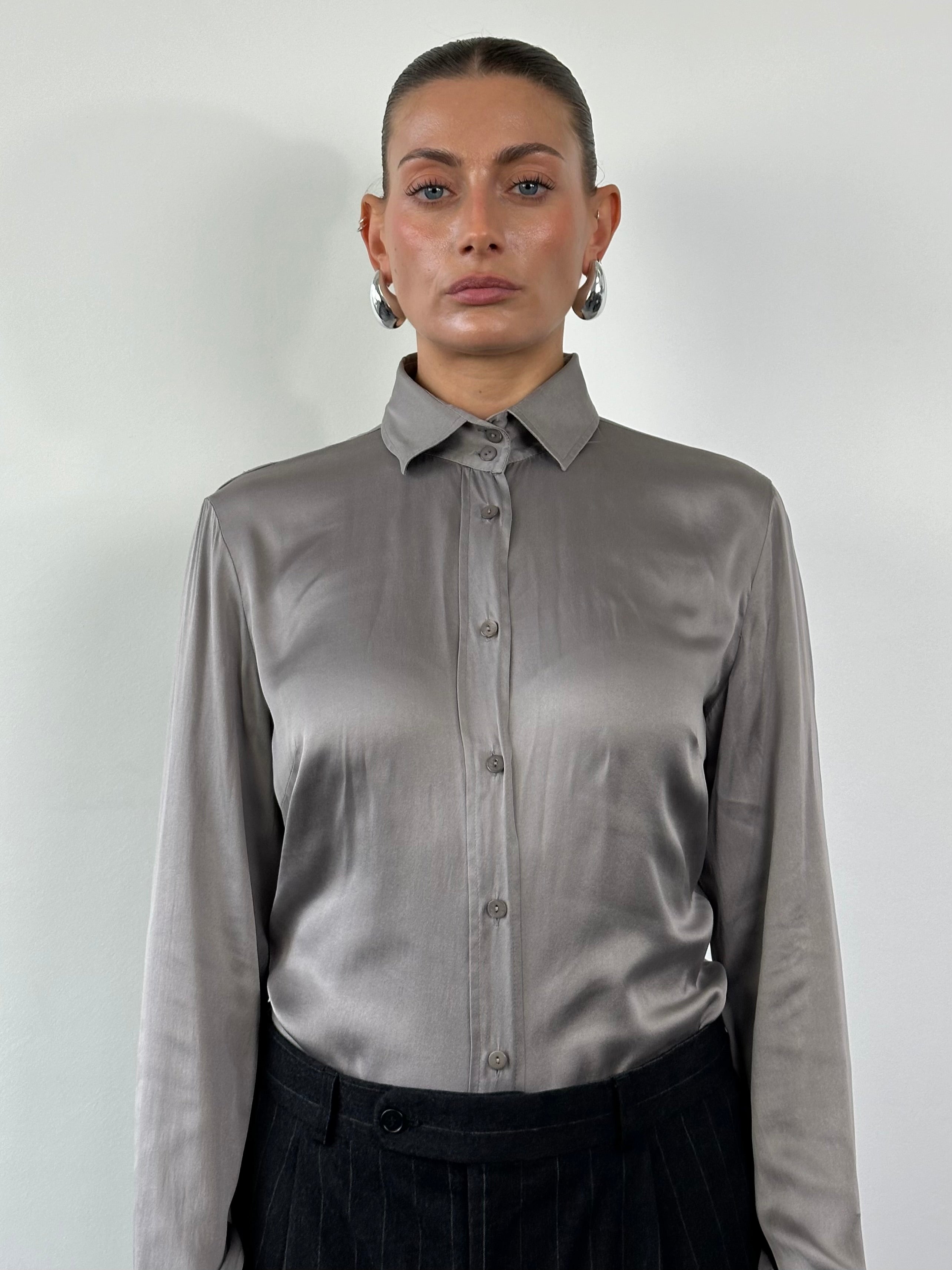 Vintage silk shirt in size M, featuring a classic design with smooth fabric and button details.