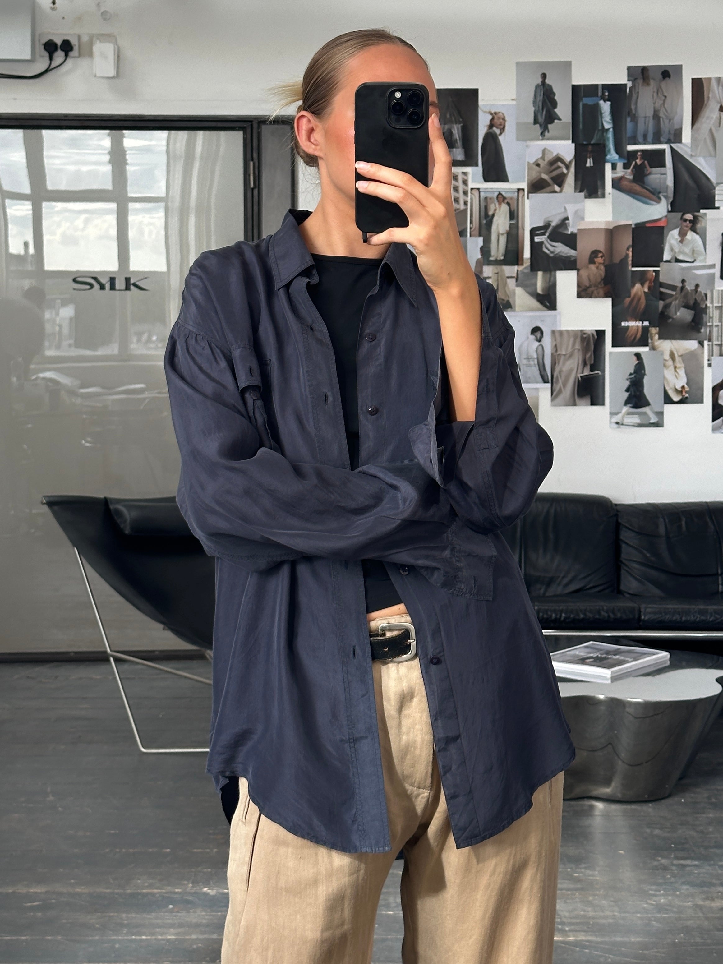 Vintage 1990s relaxed pure silk shirt in XL, featuring a classic design and smooth fabric, displayed on a hanger.