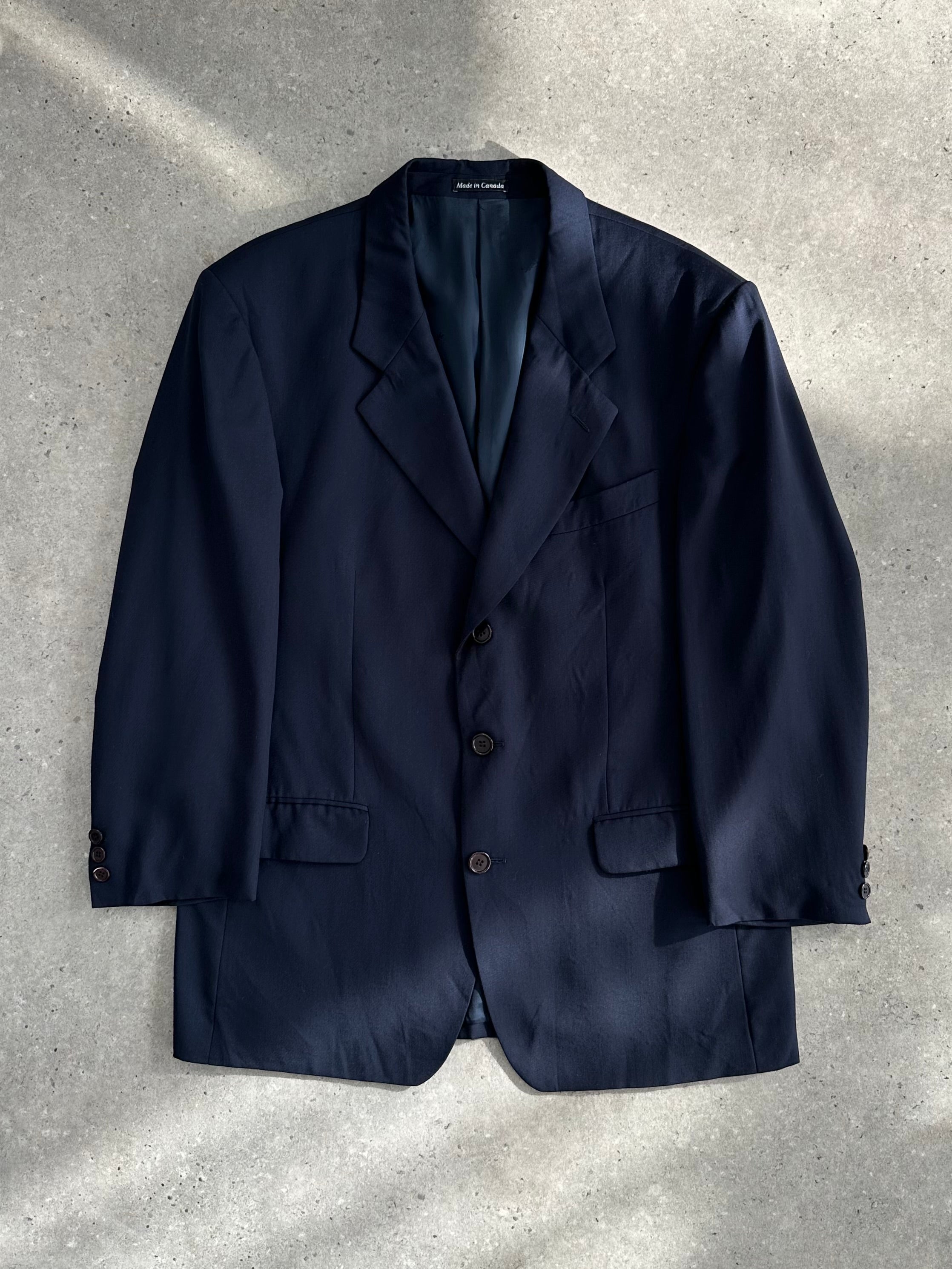 Yves Saint Laurent Pour Homme 1990s wool single-breasted blazer in size L/XL, dark tailored blazer with notch lapel and structured fit.