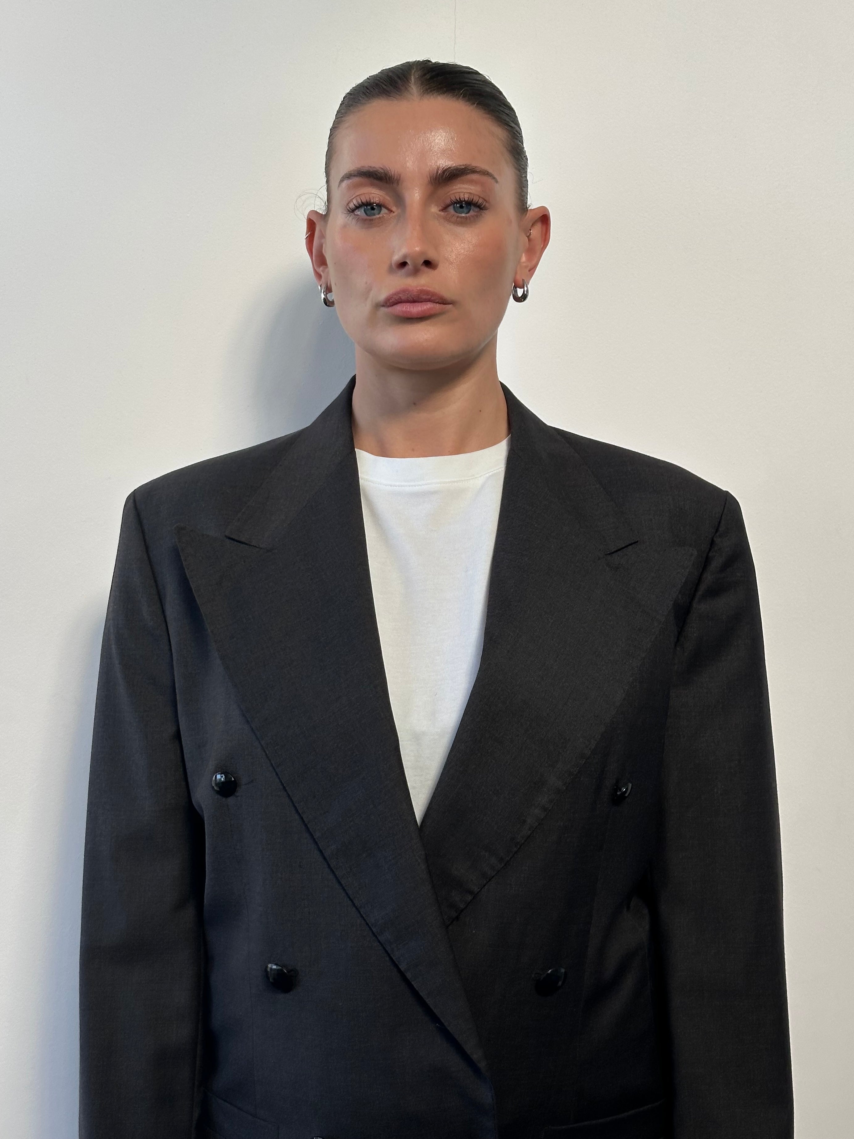 Versace 80s pure wool cropped double-breasted blazer in black, tailored with wide lapels and button details, size S/M.