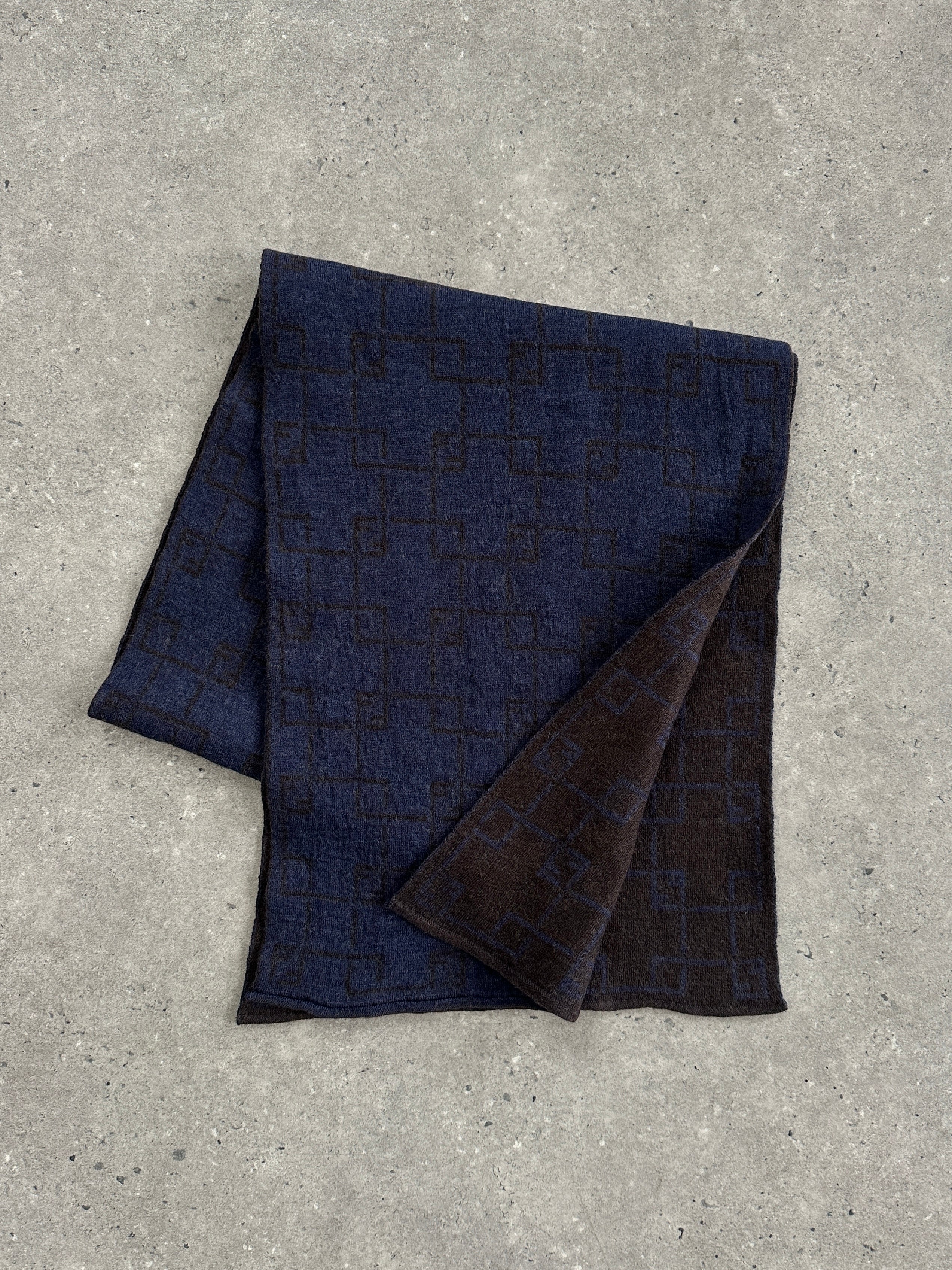 Fendi wool check scarf featuring a classic plaid pattern in neutral tones, soft and warm for stylish winter wear.