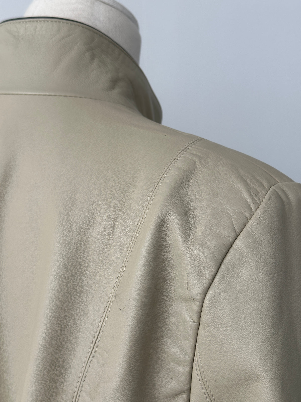 Vintage 1990s high neck leather jacket with contrast panels, size M, featuring classic vintage style and detailed stitching.