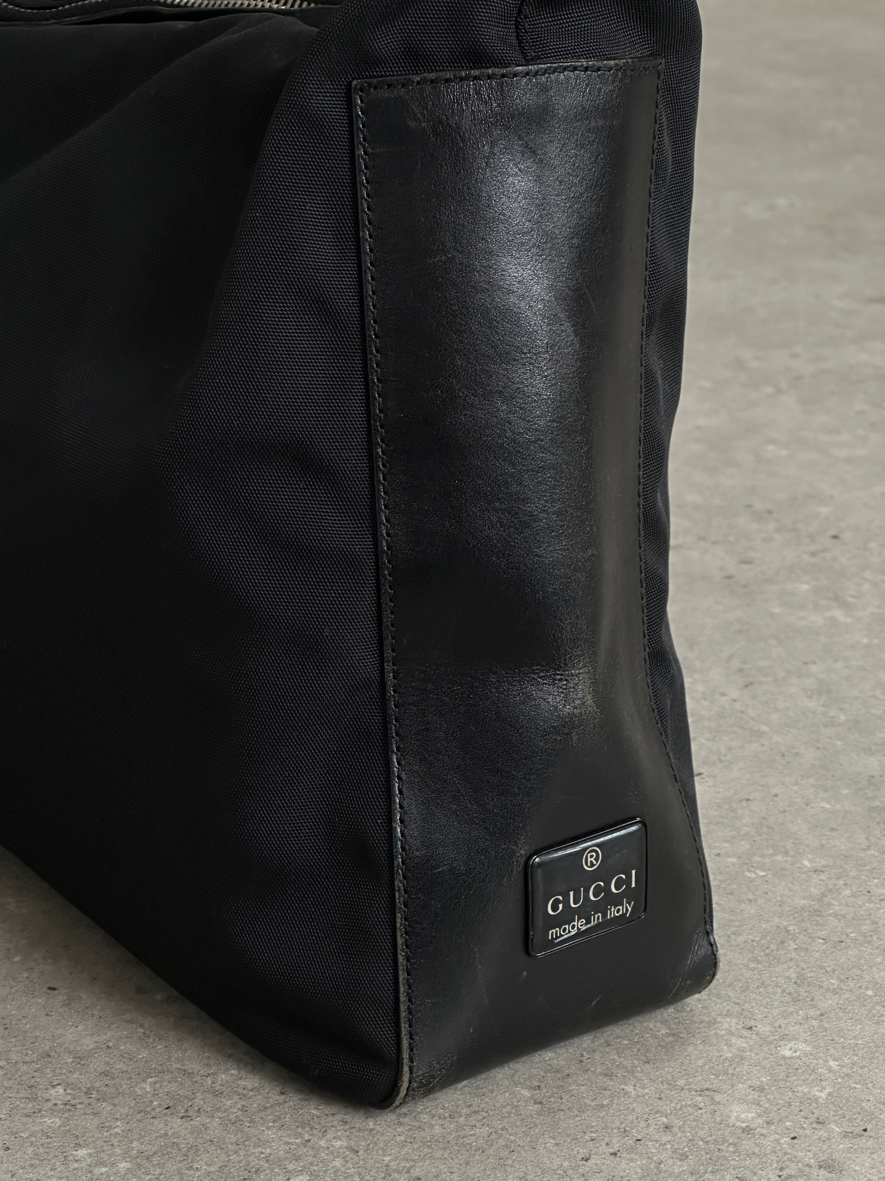 Gucci 1990s Tom Ford canvas and leather hobo shoulder bag with stylish design and spacious interior.