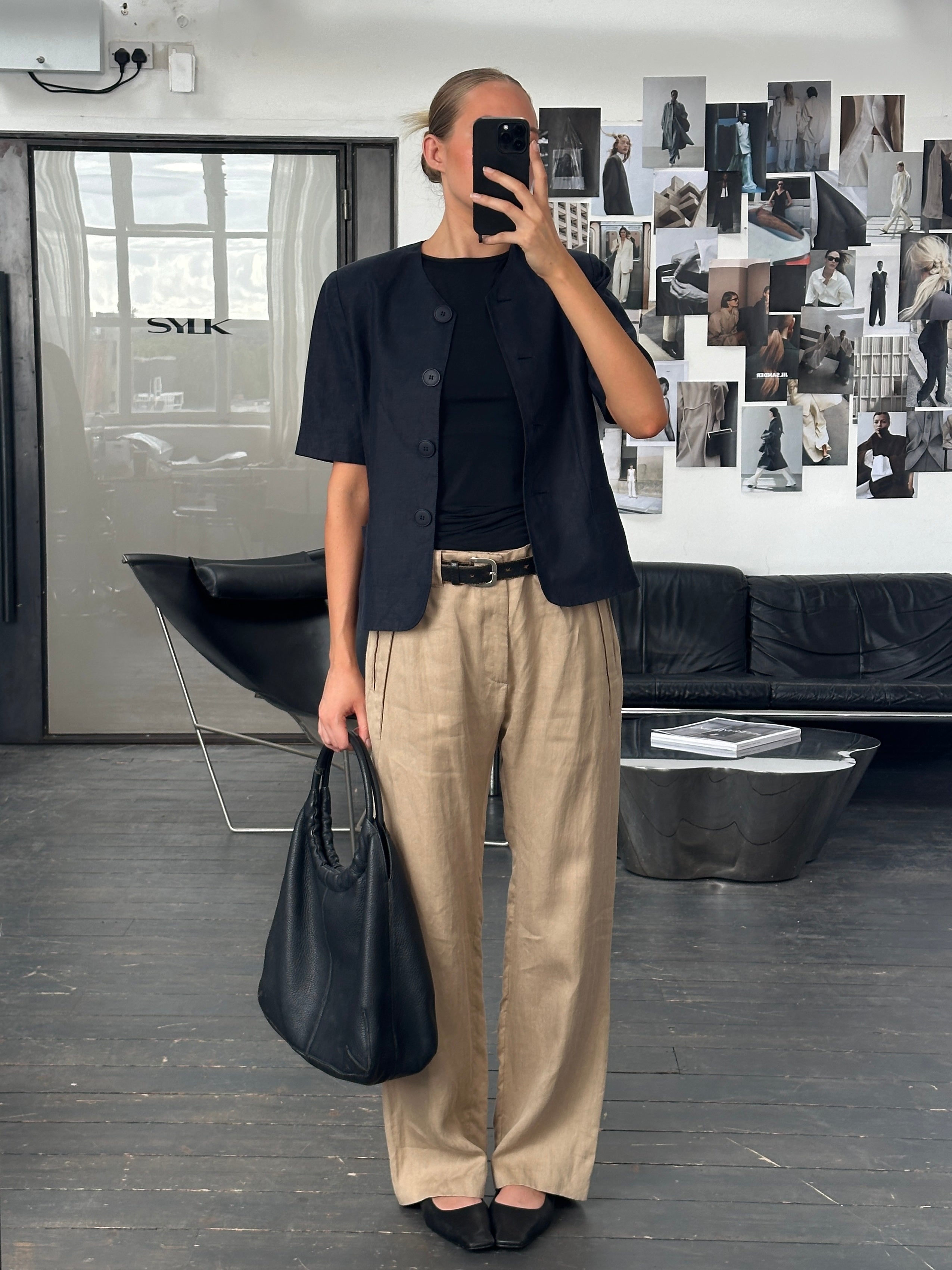 Versace 1990s pure ramie wide-leg trousers in W34, beige color, showing the relaxed fit and high waist design.
