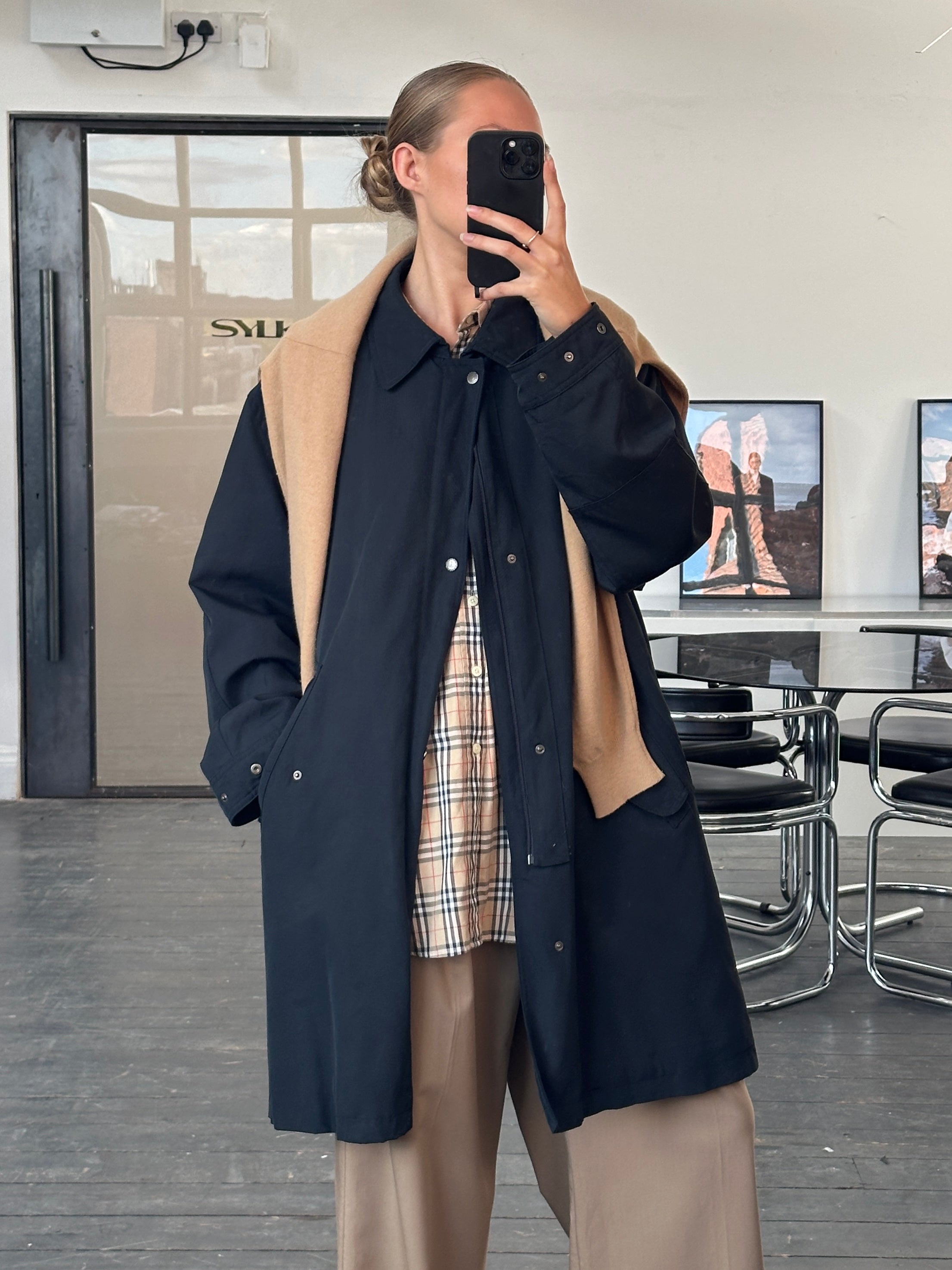 Burberry London 1990s waterproof Nova Check trench coat in XL/XXL, shown on a hanger with classic plaid pattern and belted waist.