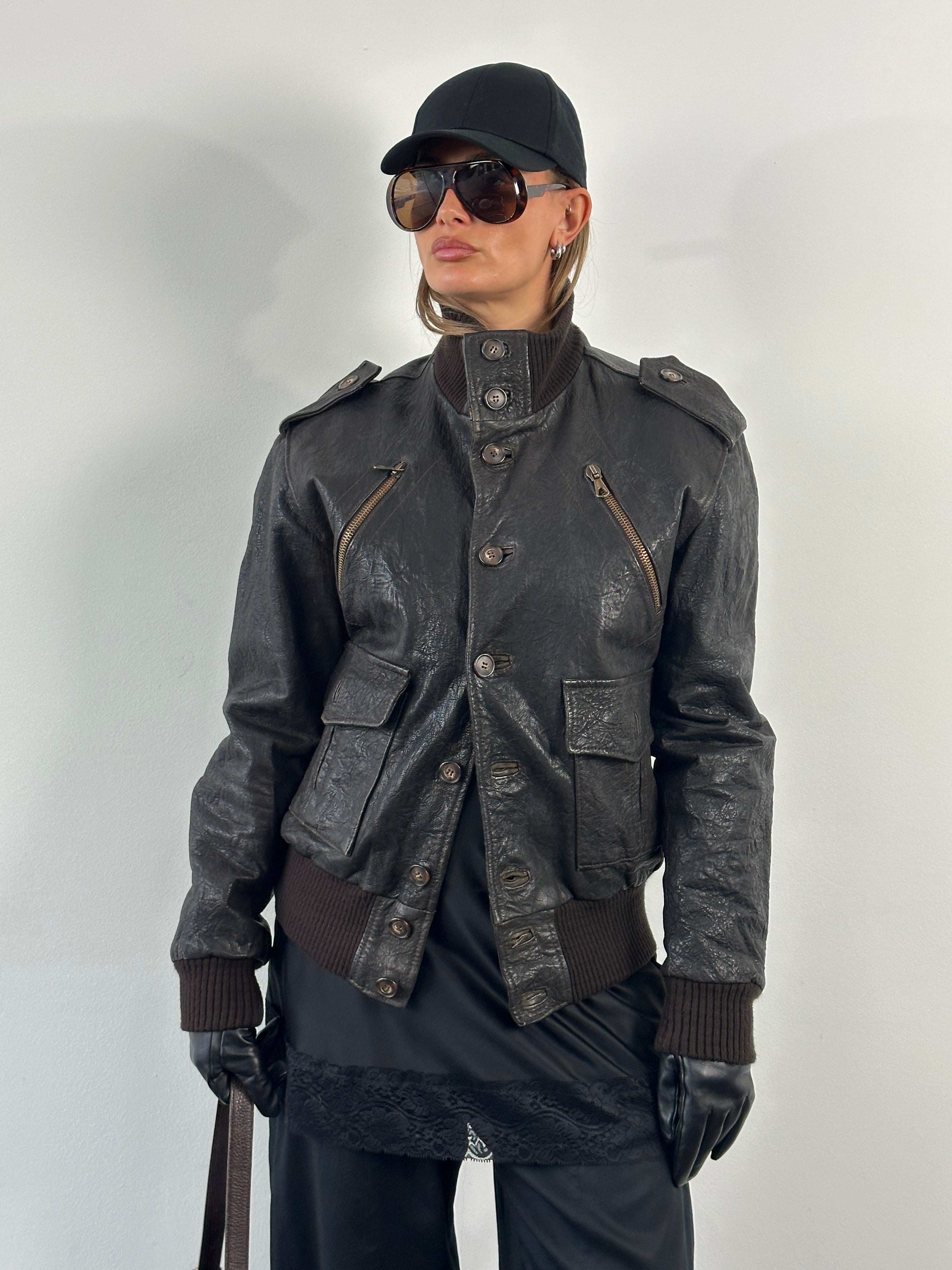 Vintage Italian 2000s textured high neck leather bomber jacket, size L, with detailed stitching and classic design.