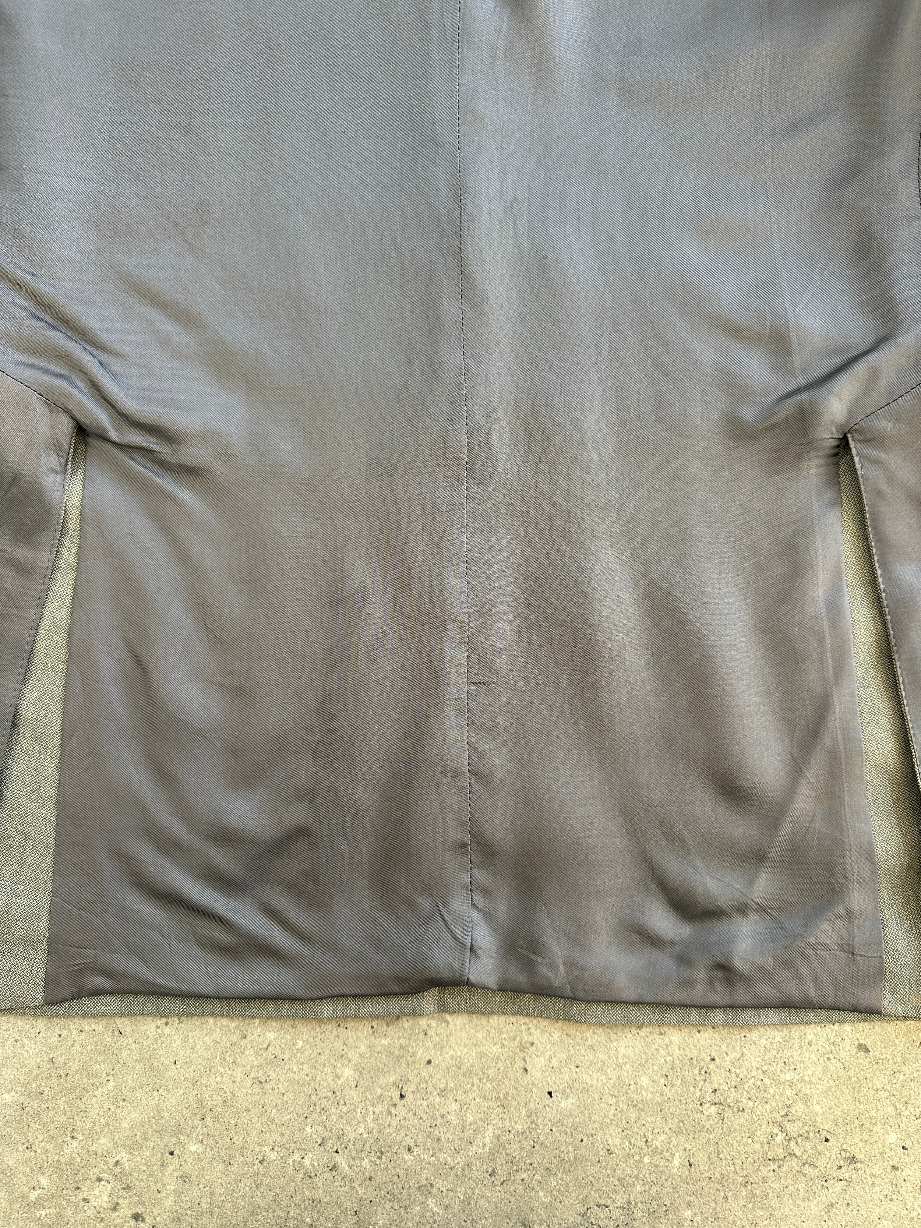 Yves Saint Laurent 1990s pure wool single-breasted blazer in size 40R/L, shown on a hanger with a tailored fit and classic lapel.