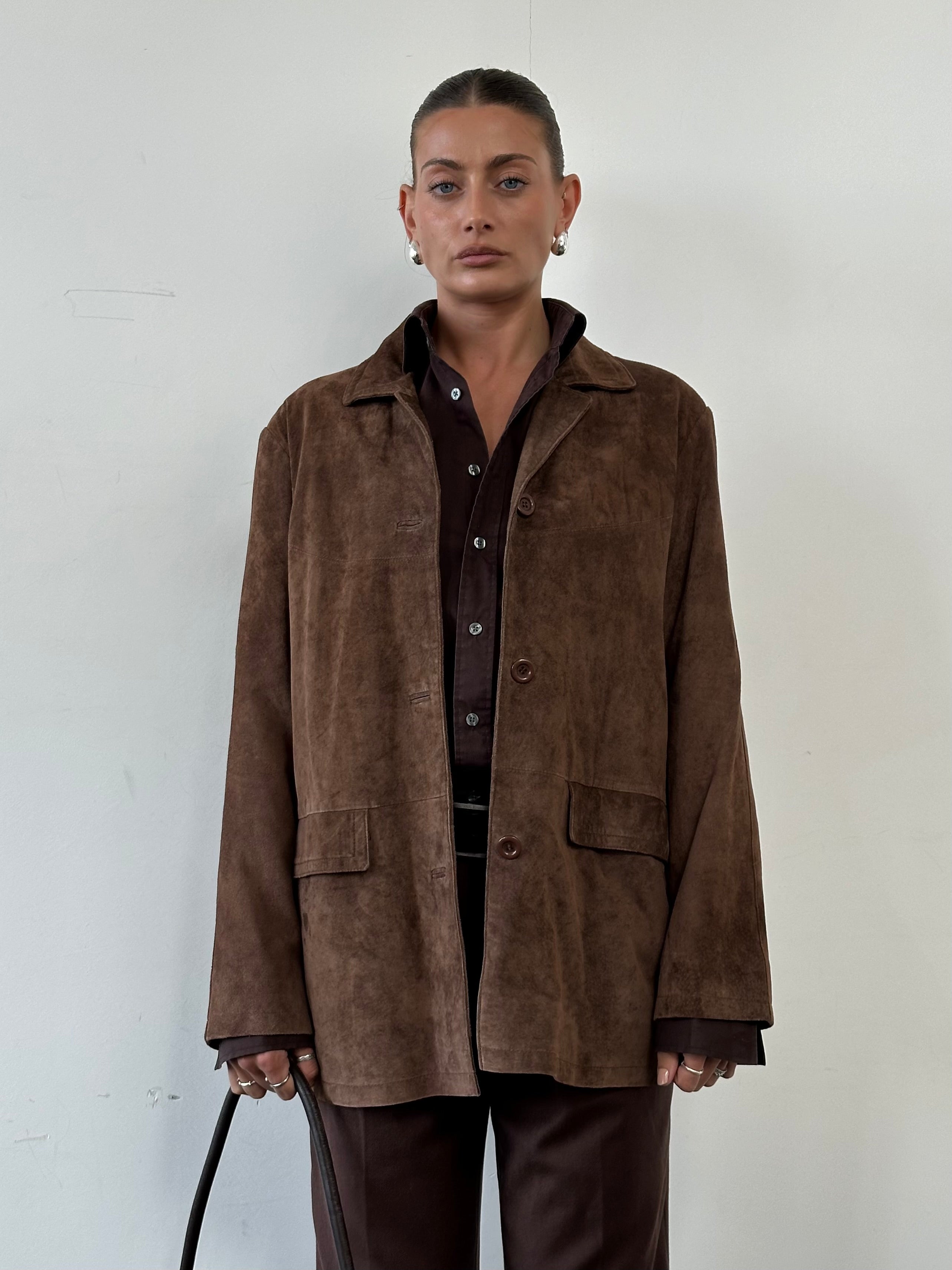 Vintage suede jacket in size large, showcasing classic design and soft brown material on a mannequin.