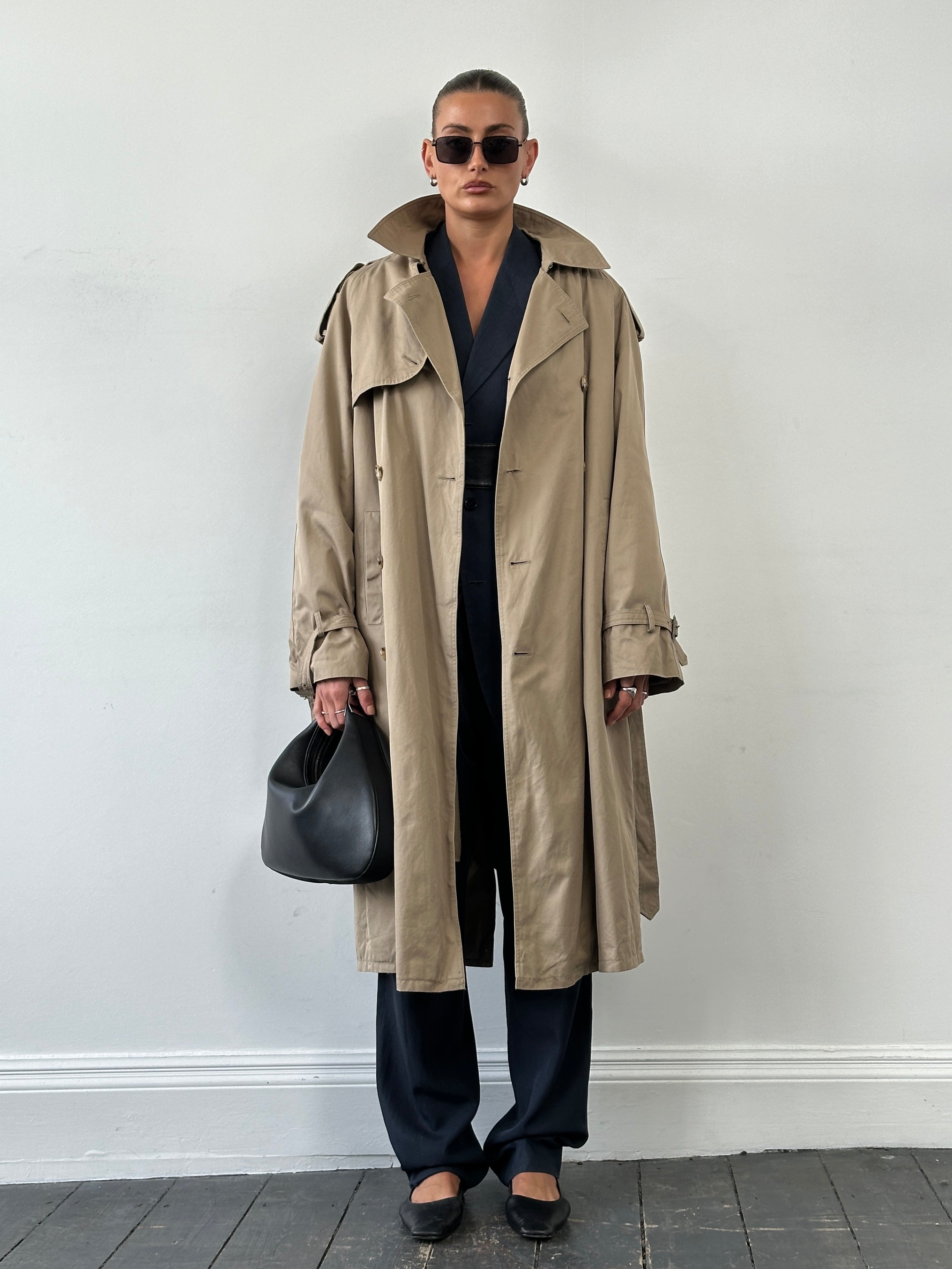 Yves Saint Laurent 80s pure cotton double-breasted belted trench coat in XL, shown in beige with classic lapels and waist belt.