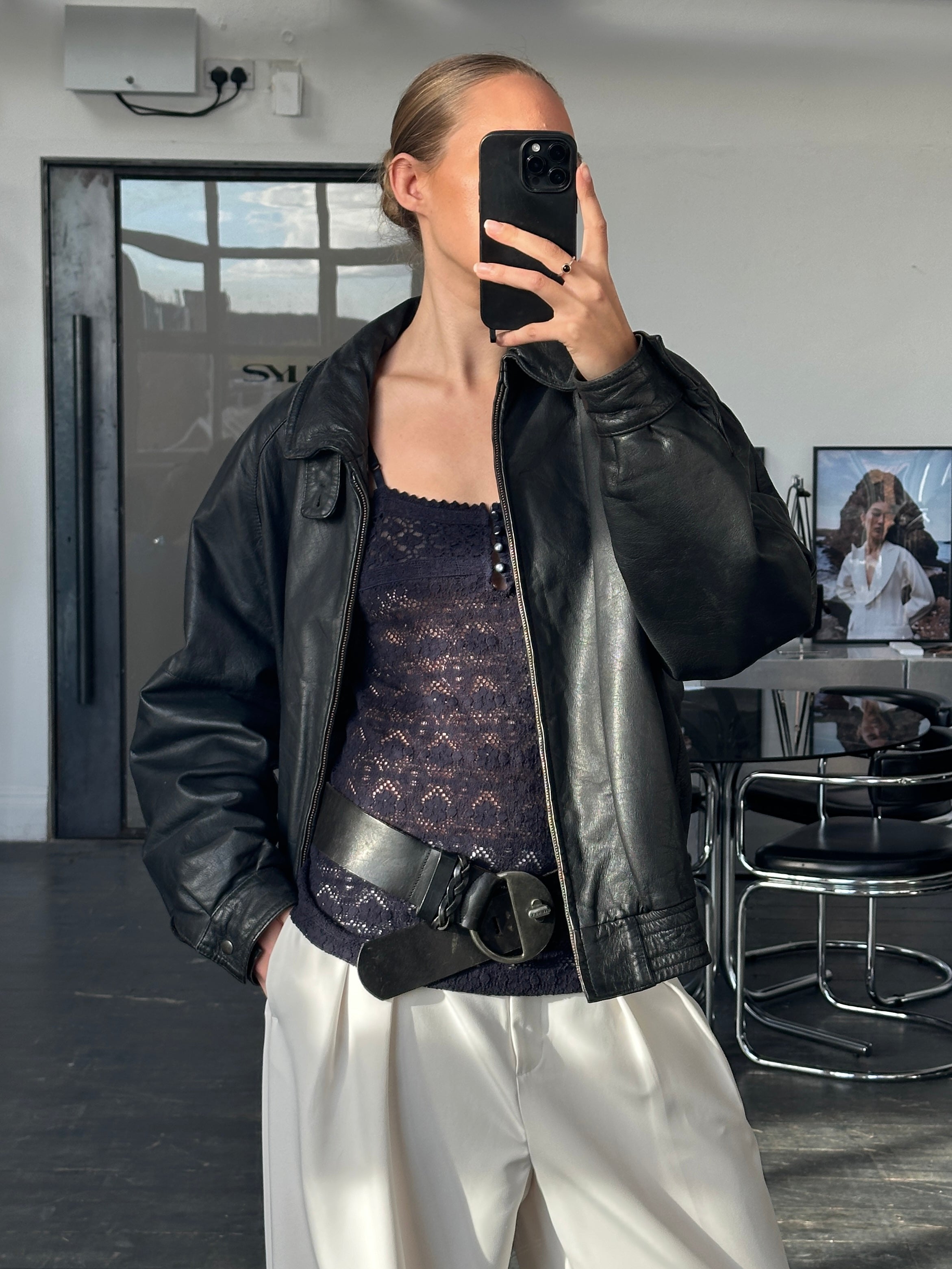 Vintage 1980s high neck leather bomber jacket, size large, featuring classic leather texture and vintage style details.