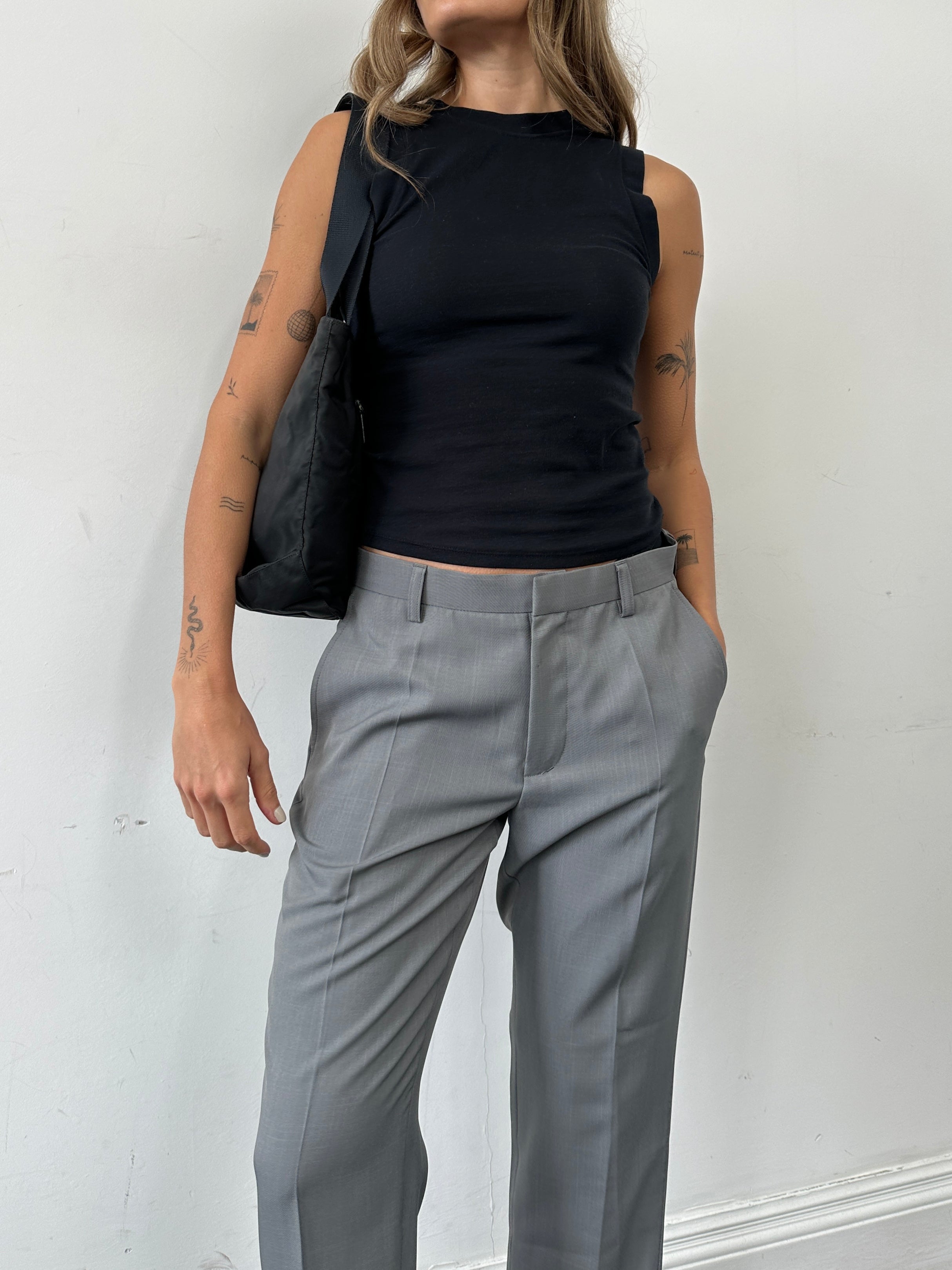 Prada 1997 nylon shoulder bag with adjustable strap, sleek design, and Prada logo detail on the front.