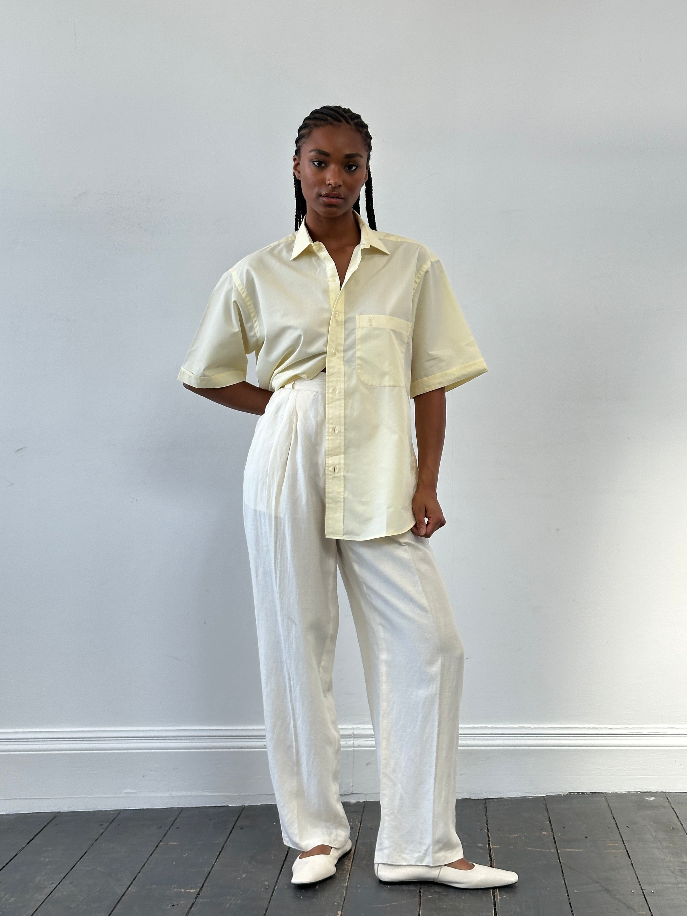 Versace 1980s silk linen high-waisted trousers in W22, shown on model with tailored fit and classic design details.