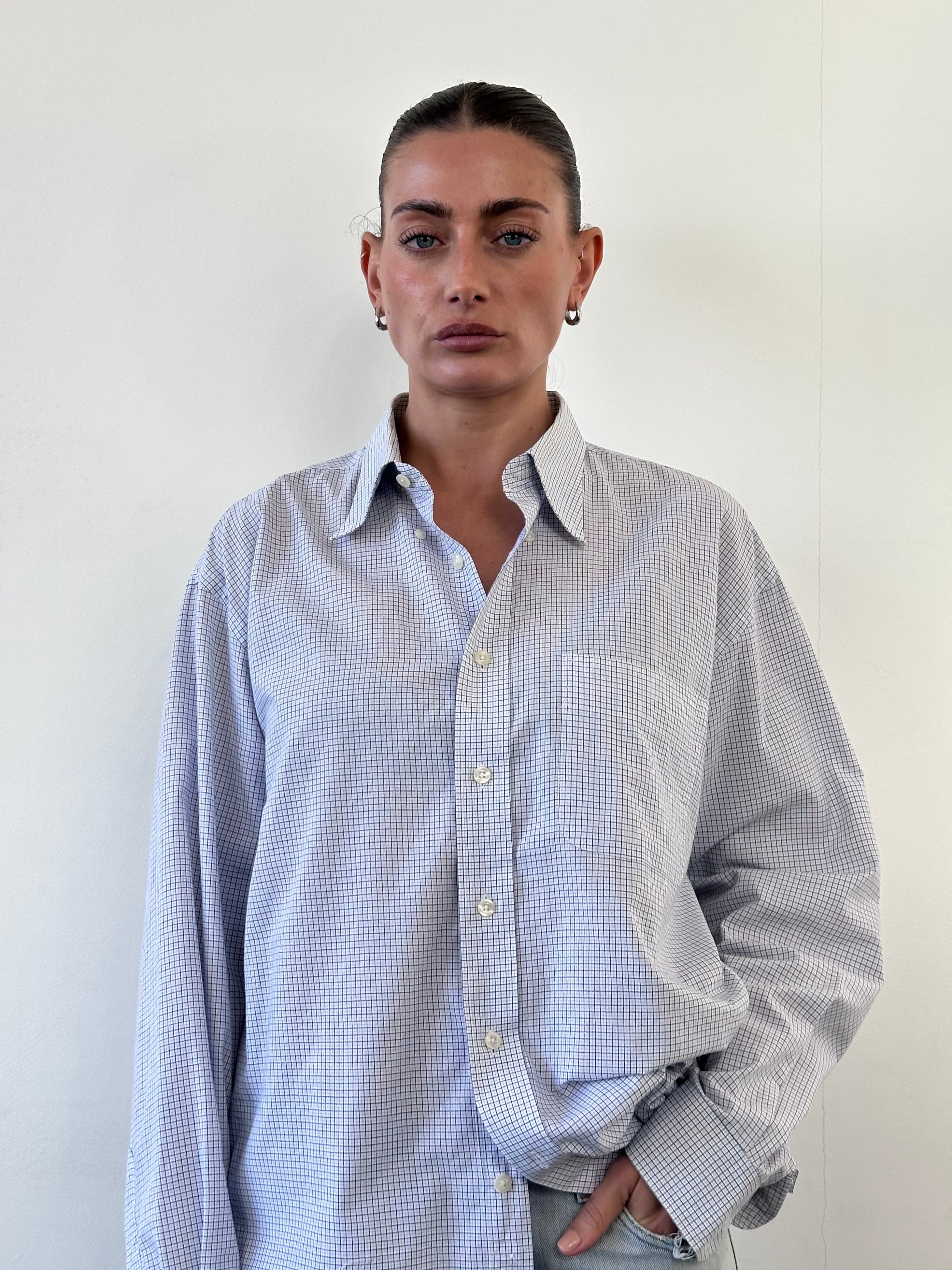 Yves Saint Laurent 90s check cotton shirt in size large to extra large, featuring classic plaid pattern and button-front design.
