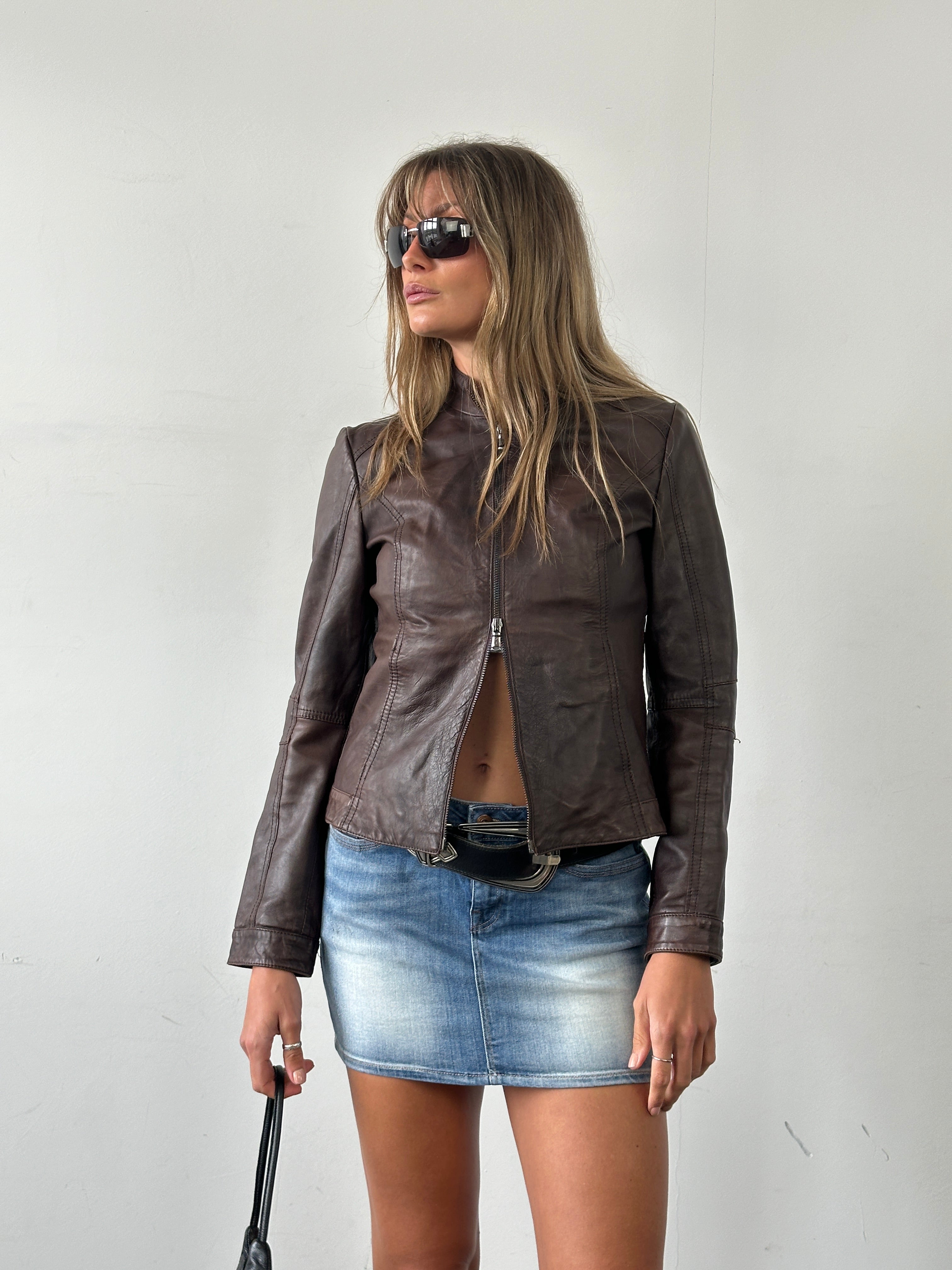 Vintage Italian double zip biker leather jacket in size small, featuring classic design and stylish hardware details.