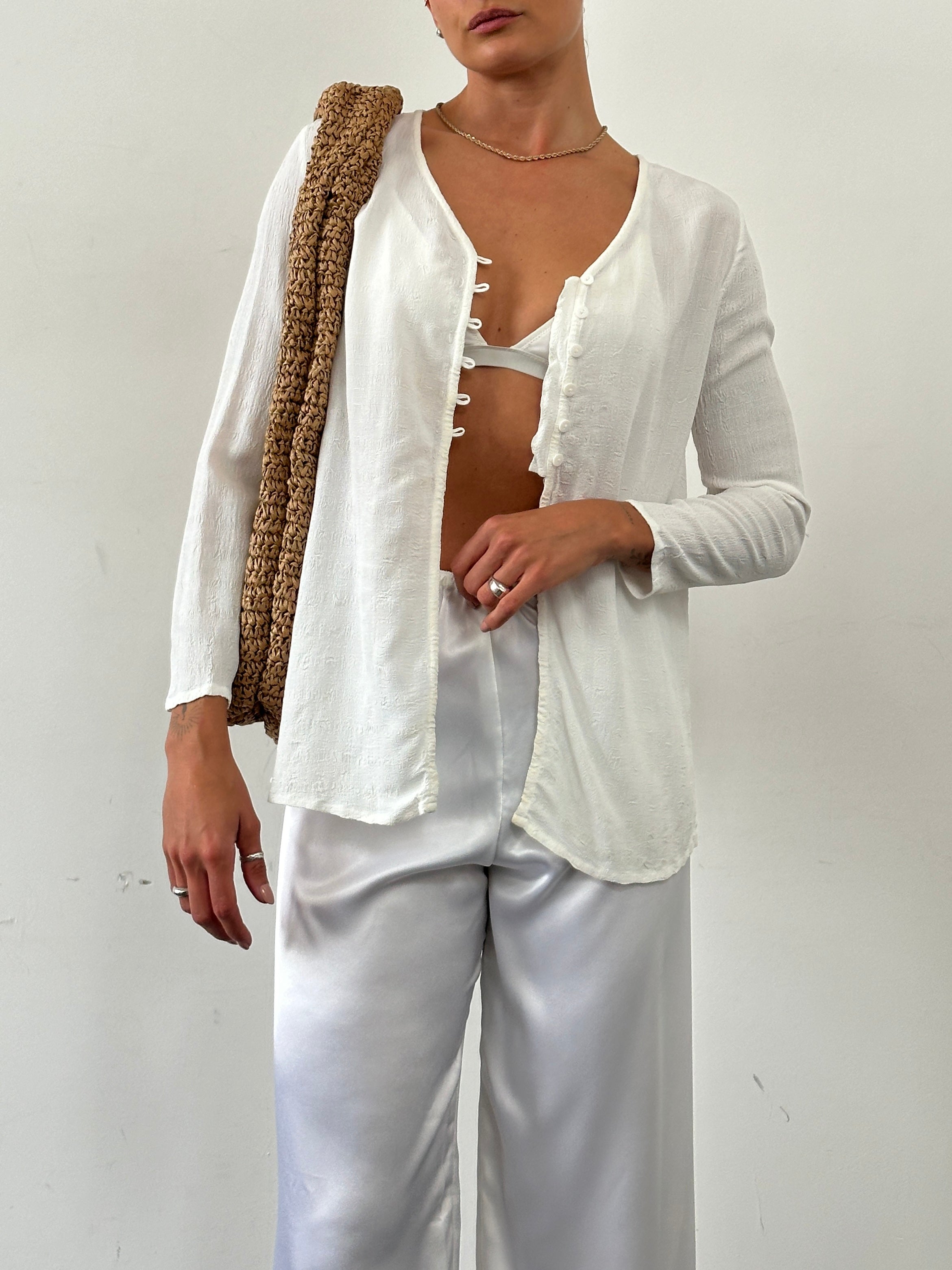 Laura Ashley textured collarless shirt in size M, shown in a close-up image highlighting the fabric and design details.