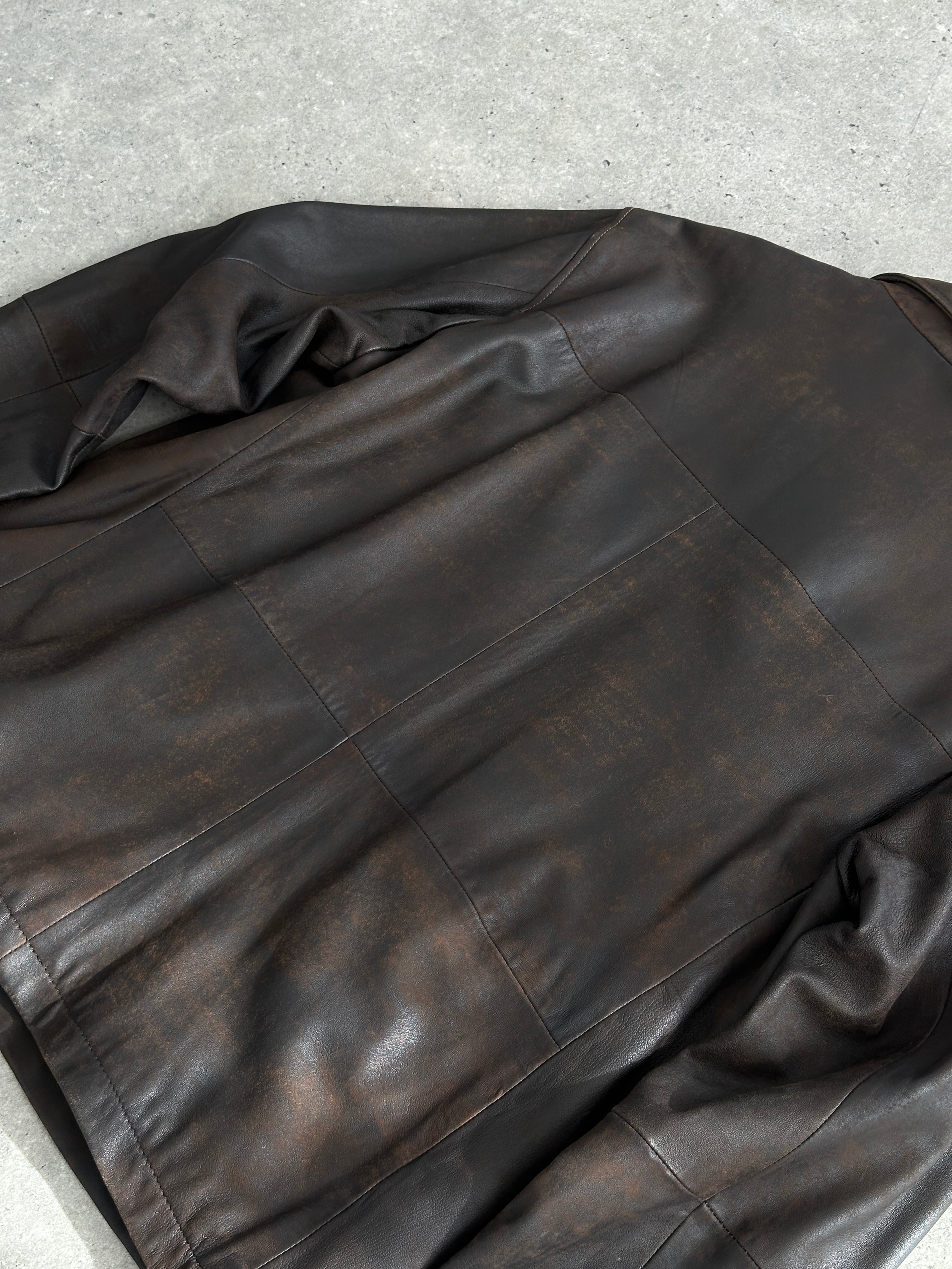 Vintage aged leather jacket in XL size, showcasing distressed brown leather with classic design and stitching details.